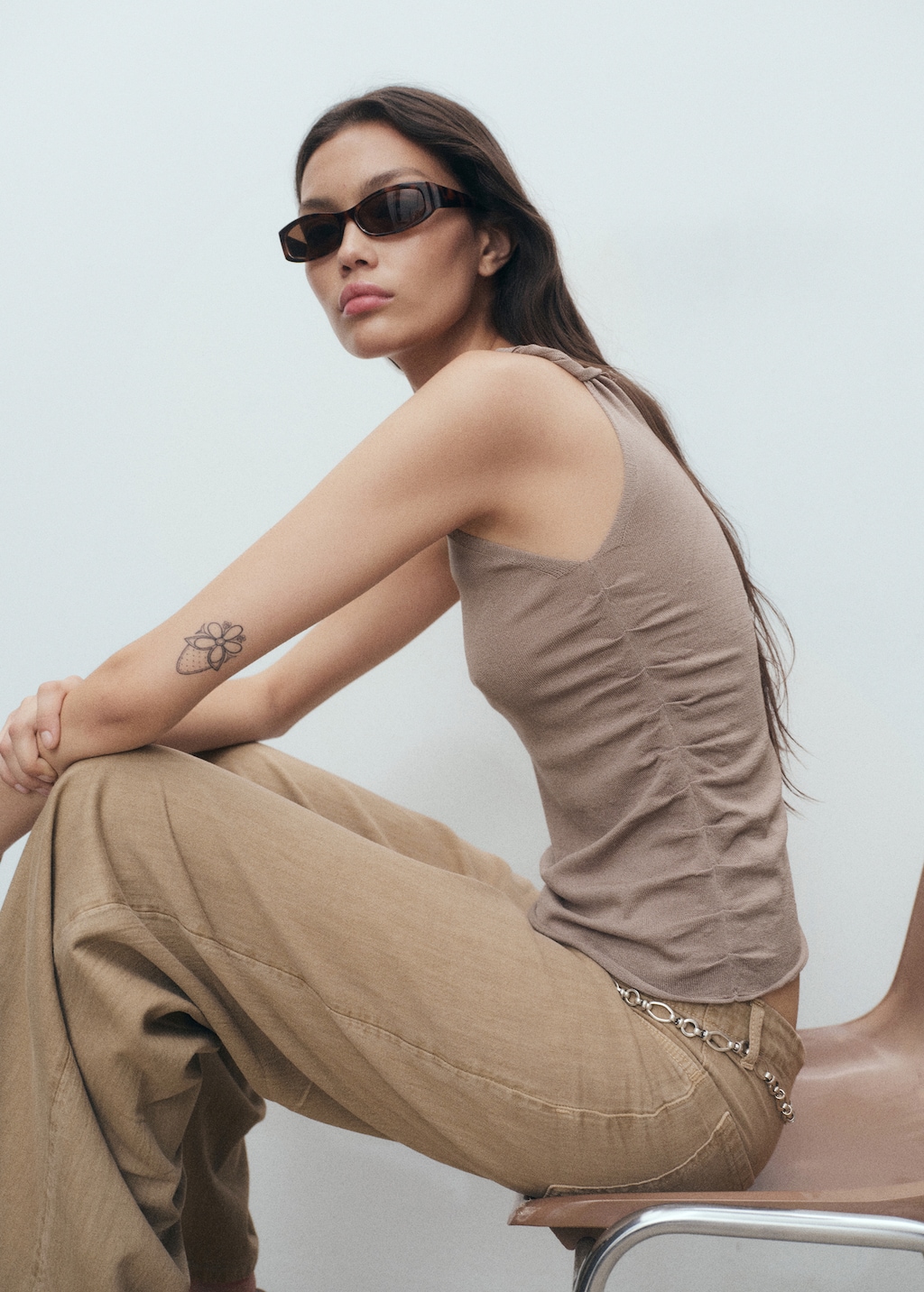 Asymmetrical knitted top with straps