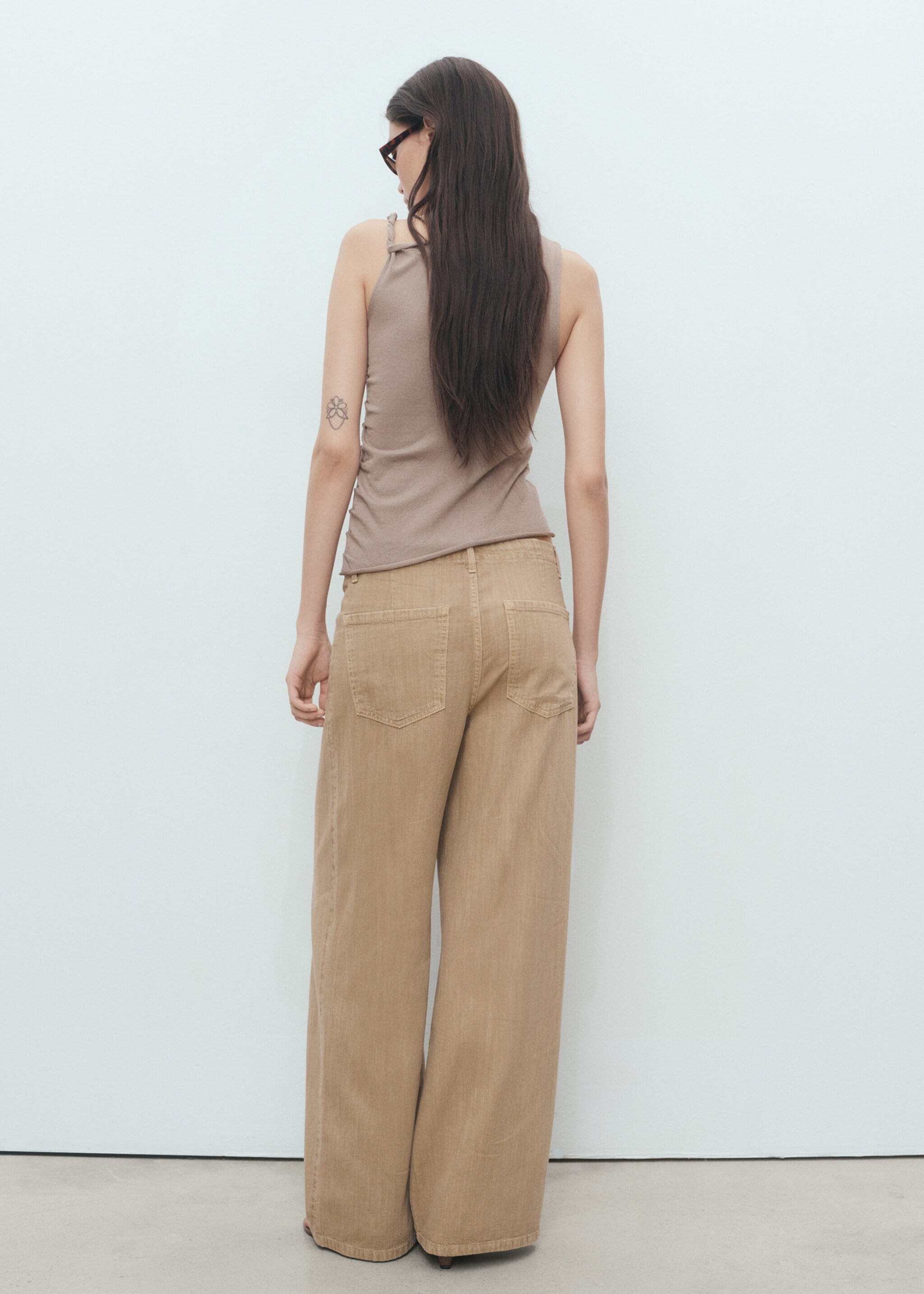 Asymmetrical knitted top with straps - Reverse of the article
