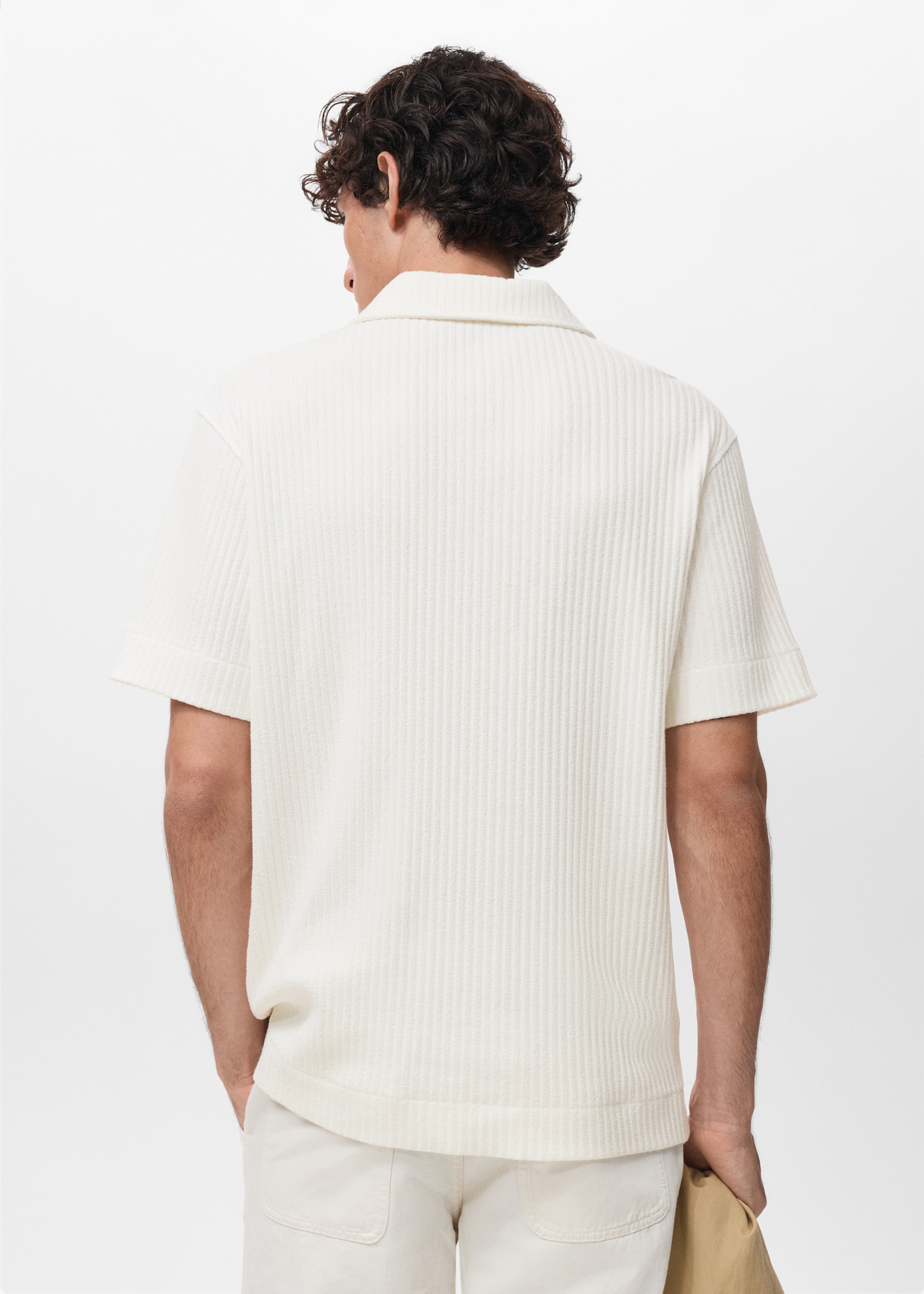 Polo de malha com textura - Verso do artigo