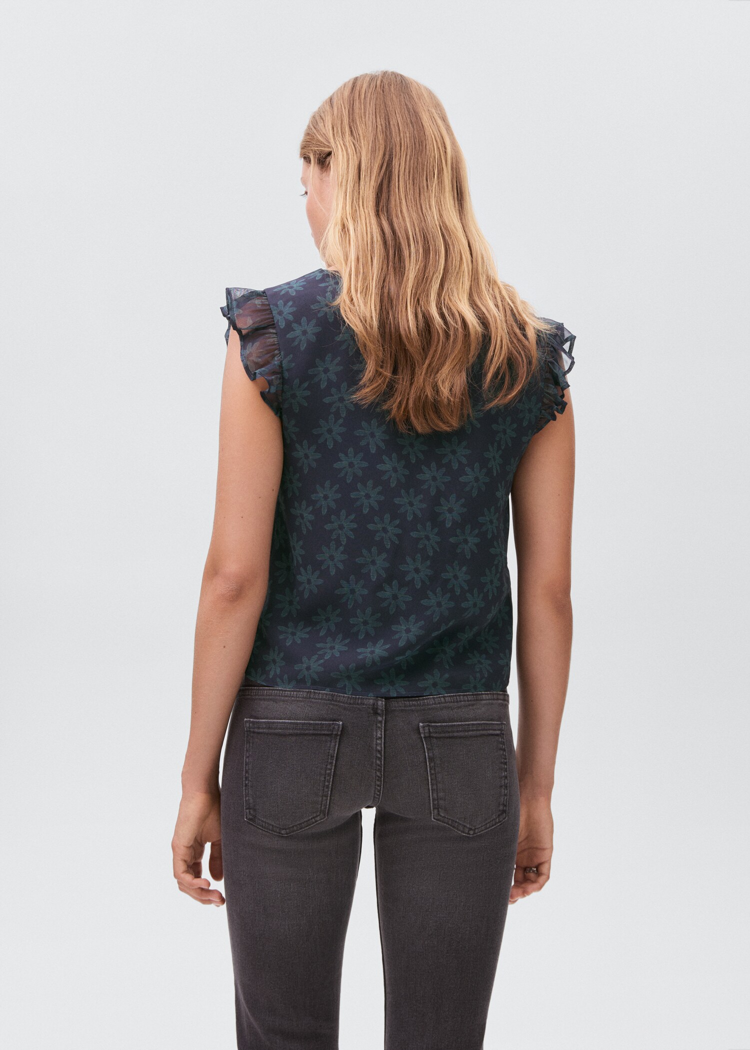 Blusa flores volantes - Reverso del artículo