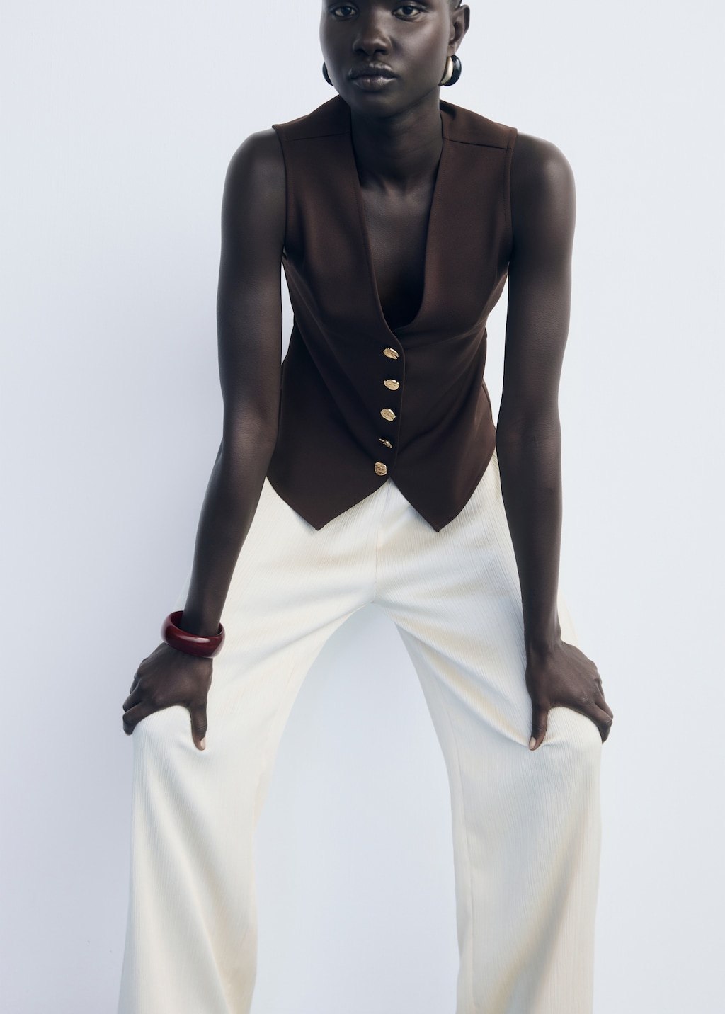 Vest with jewel buttons