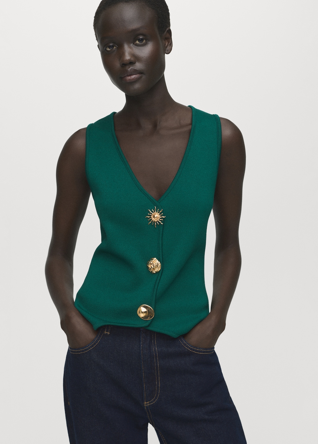 Knitted vest with jewel buttons