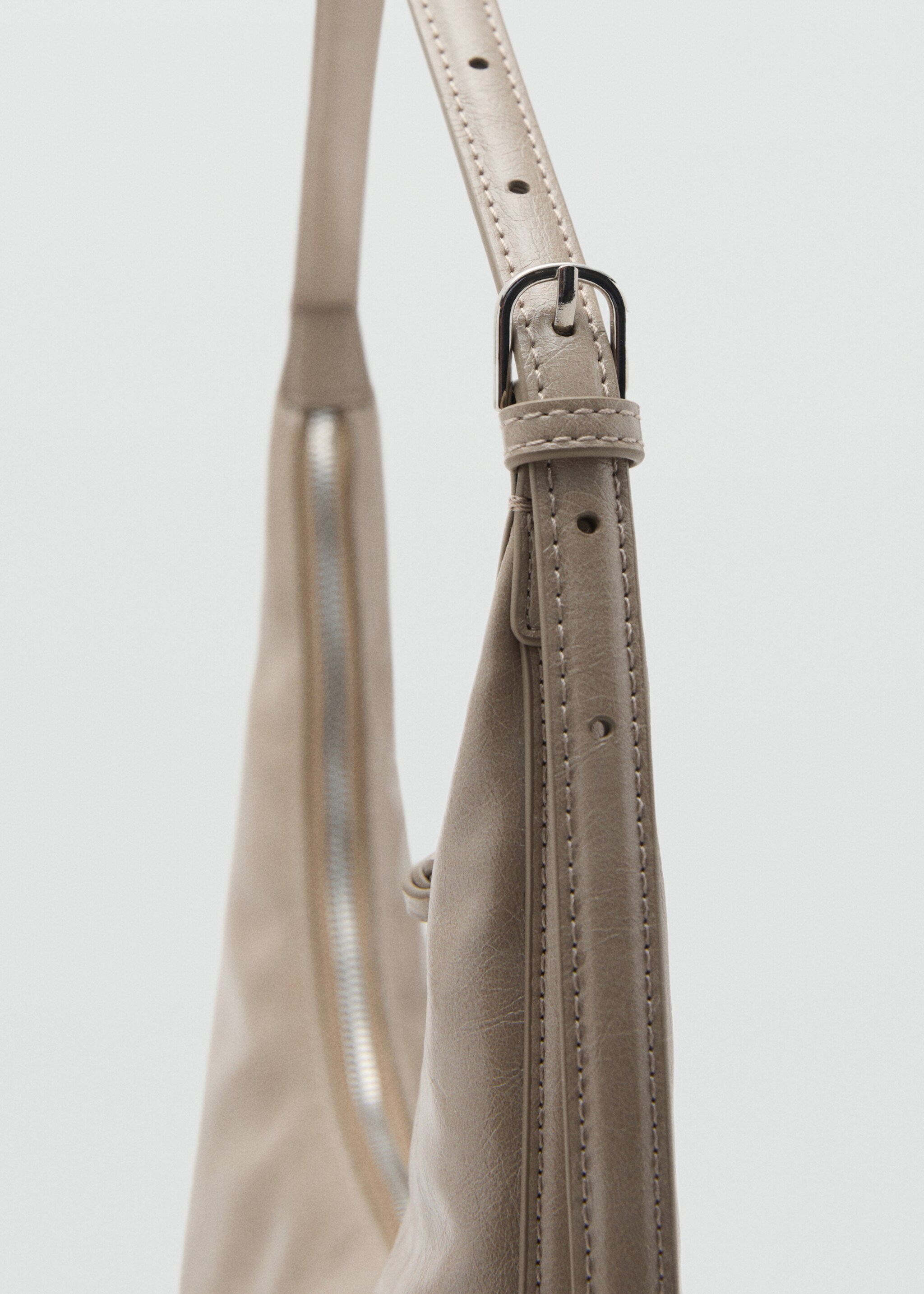 Medium oval bag with a pebbled effect - Details of the article 1, Light/Pastel Brown. Ref: 17095792-00.