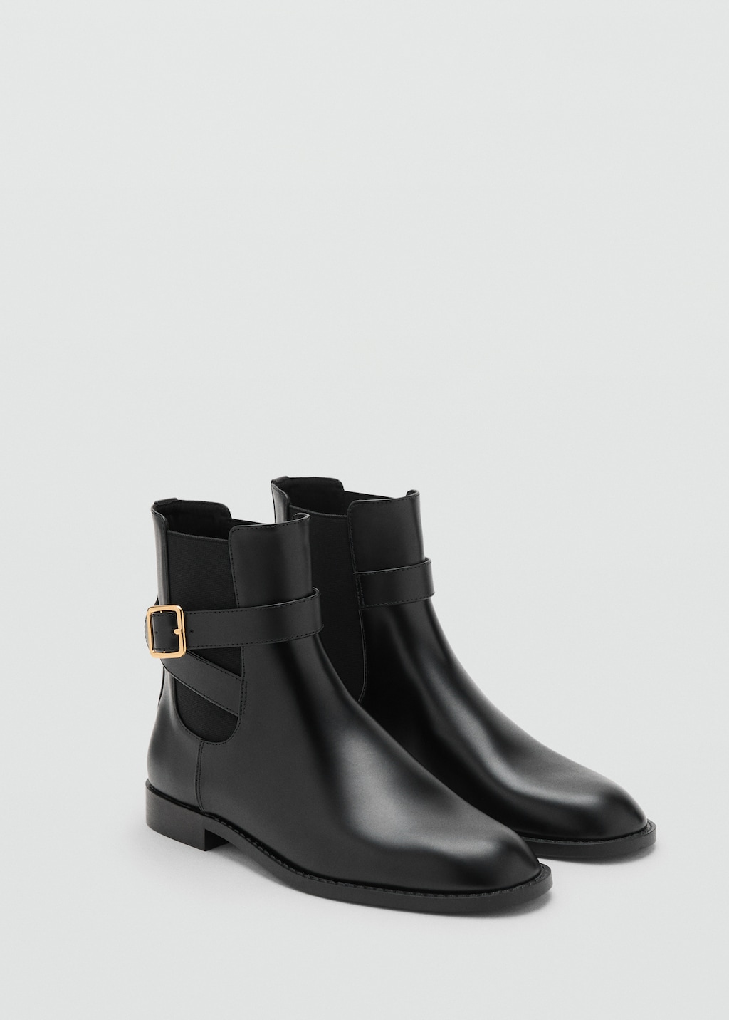 Ankle boots with elastic panel and buckle