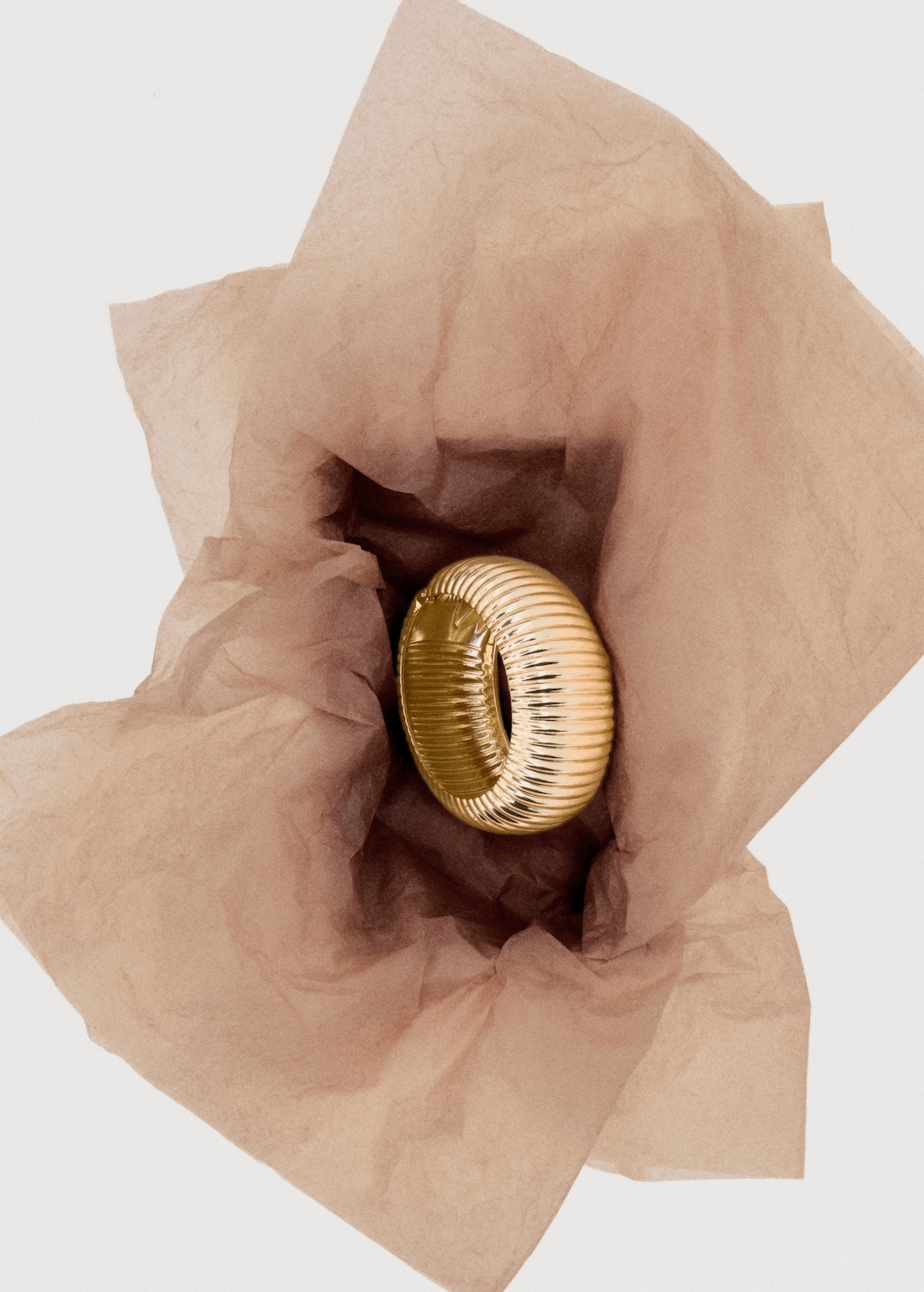 Rigid bracelet with relief