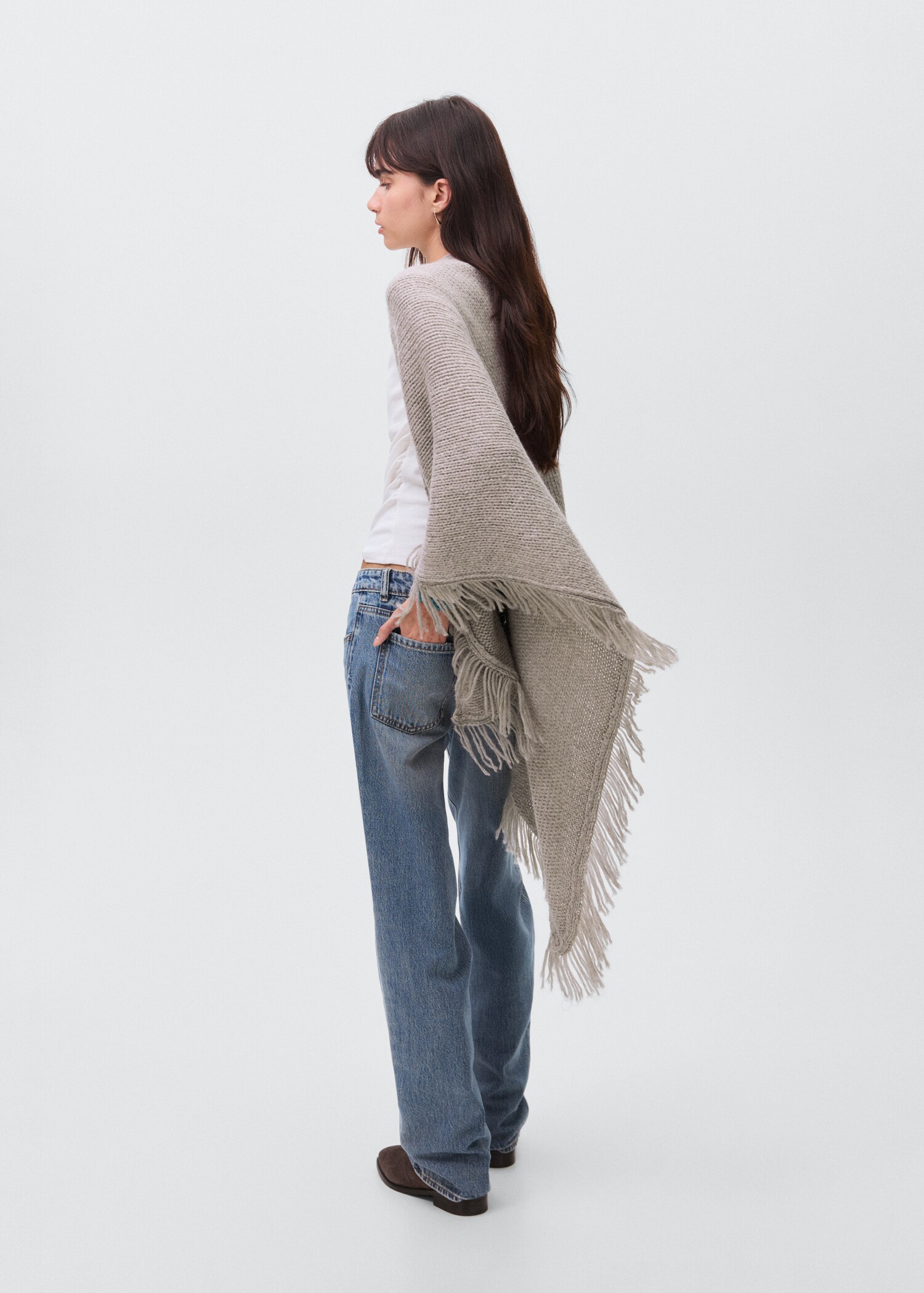 Knitted poncho with tassels - Reverse of the article
