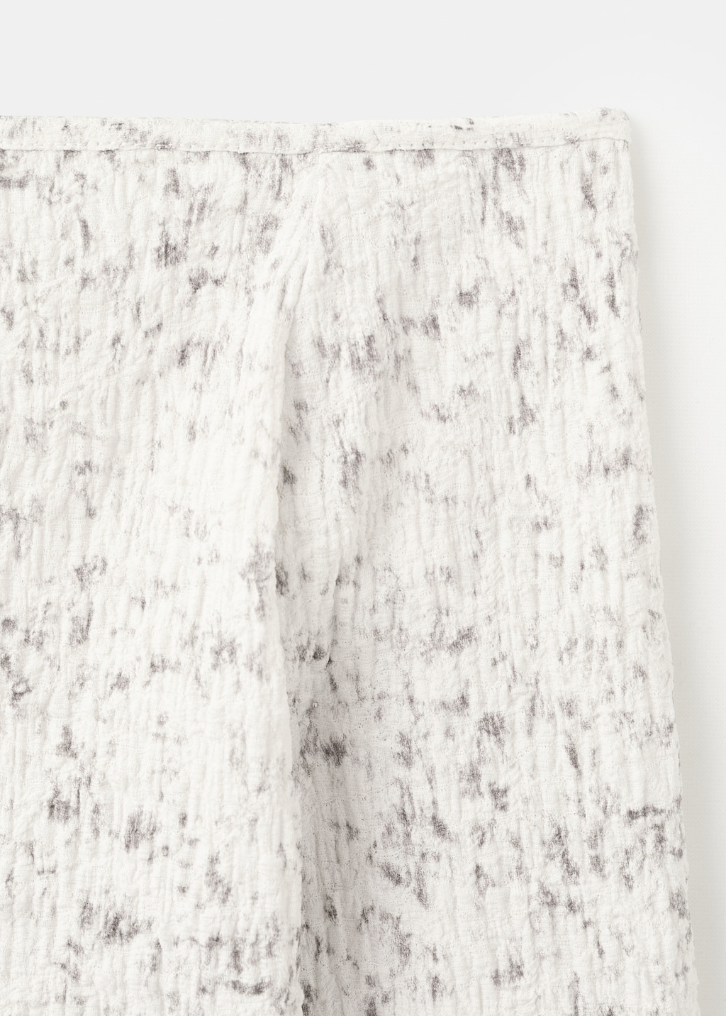 Speckled t-shirt with an asymmetrical neckline