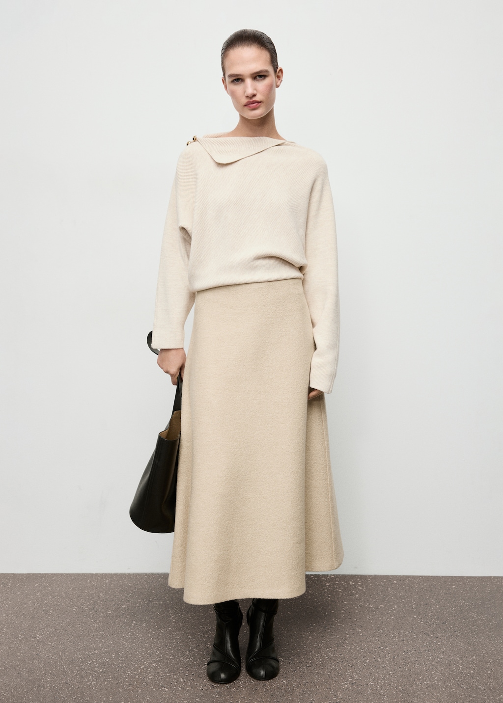 Sweater with asymmetrical neck and jewel buttons