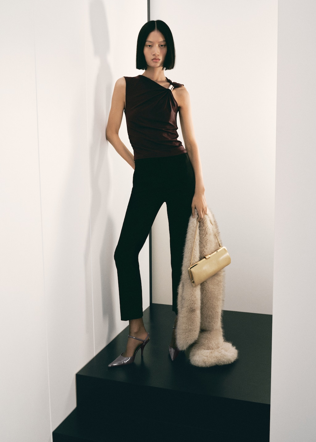 Top with asymmetrical neckline and metallic detail