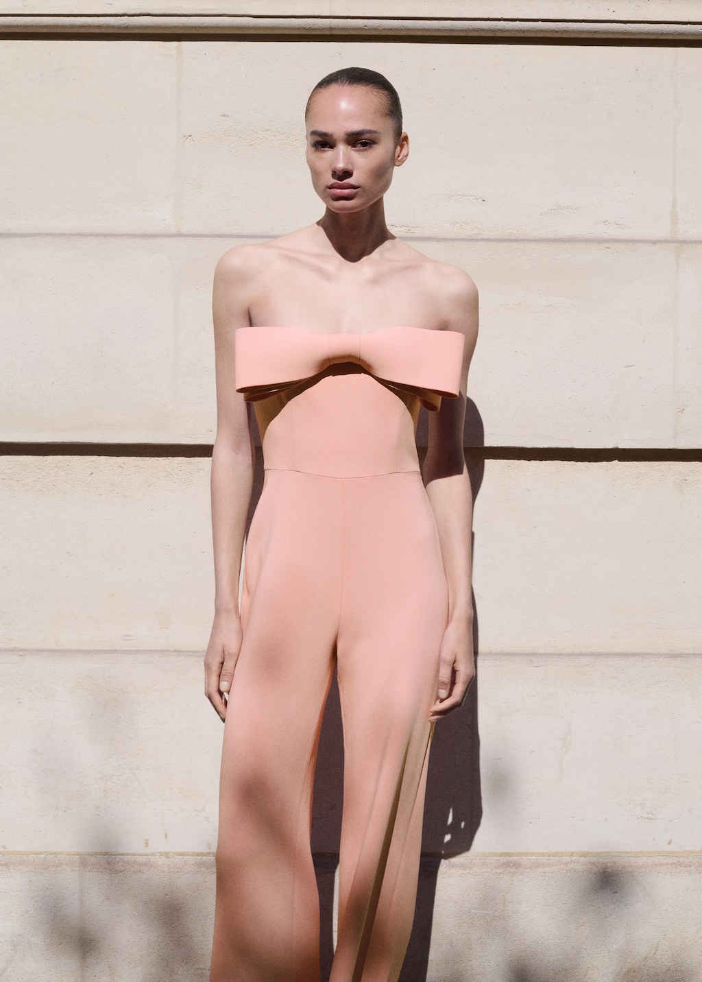 Strapless jumpsuit with bow neckline
