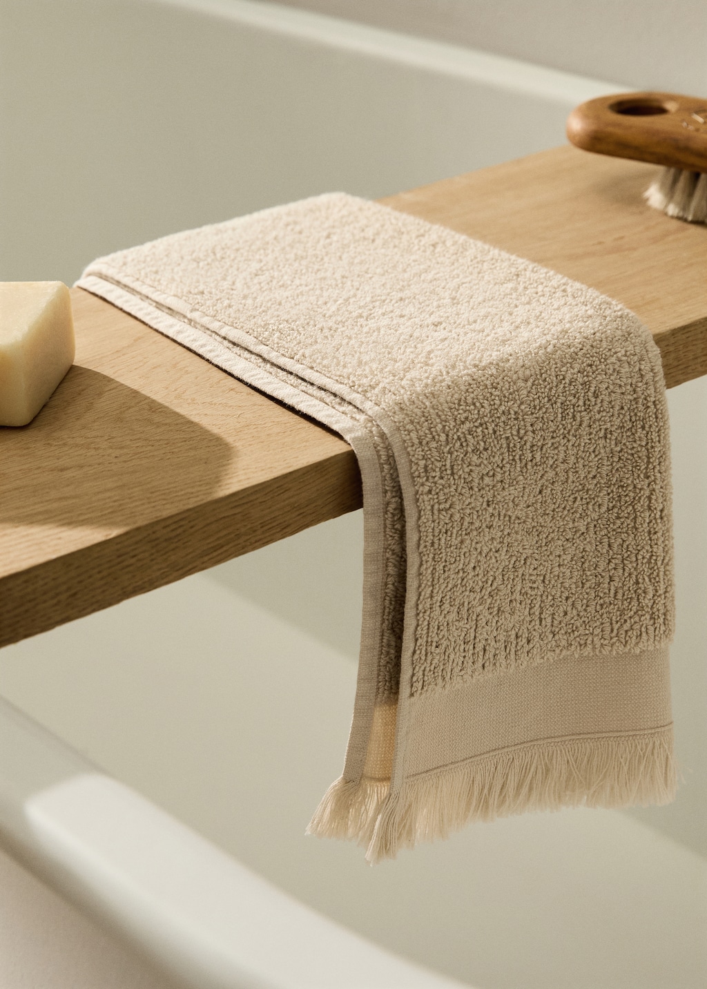 Textured guest towel with fringes
