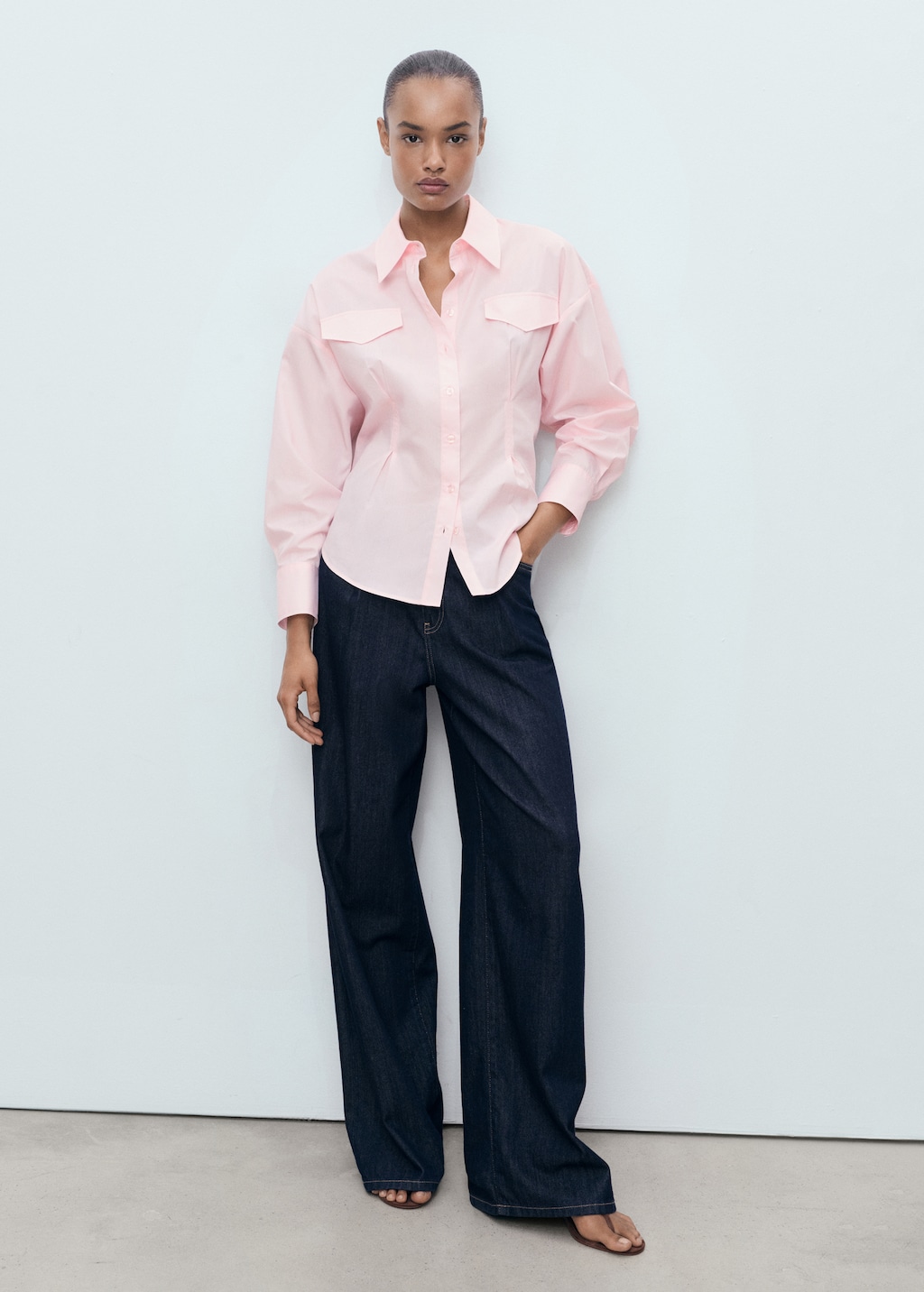 Shirt with pleats and pockets