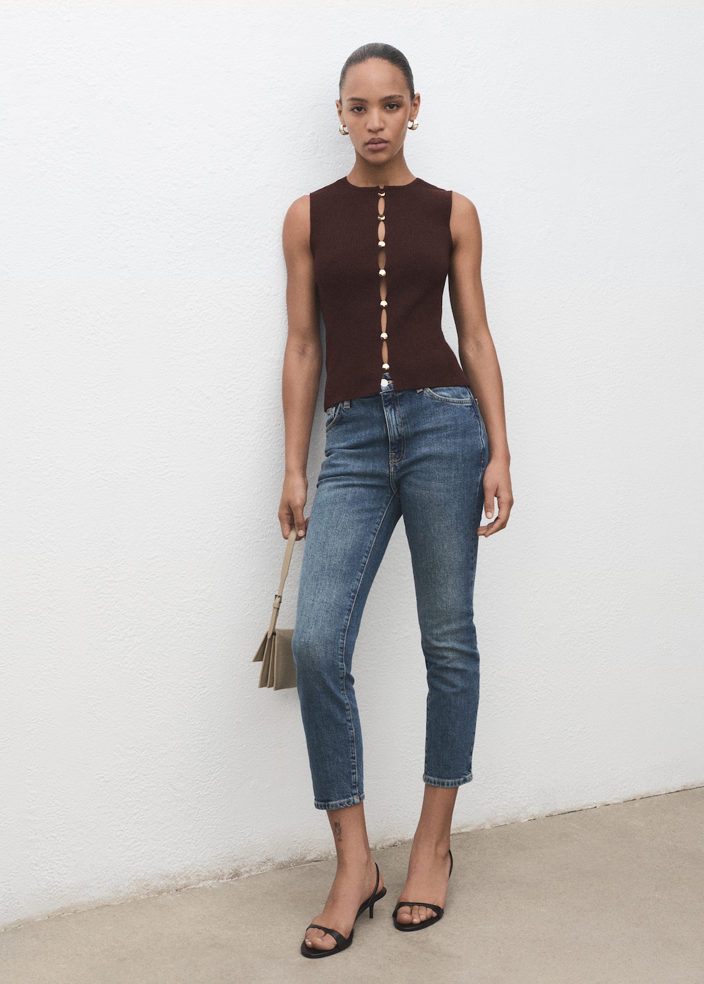 Knitted vest with slits