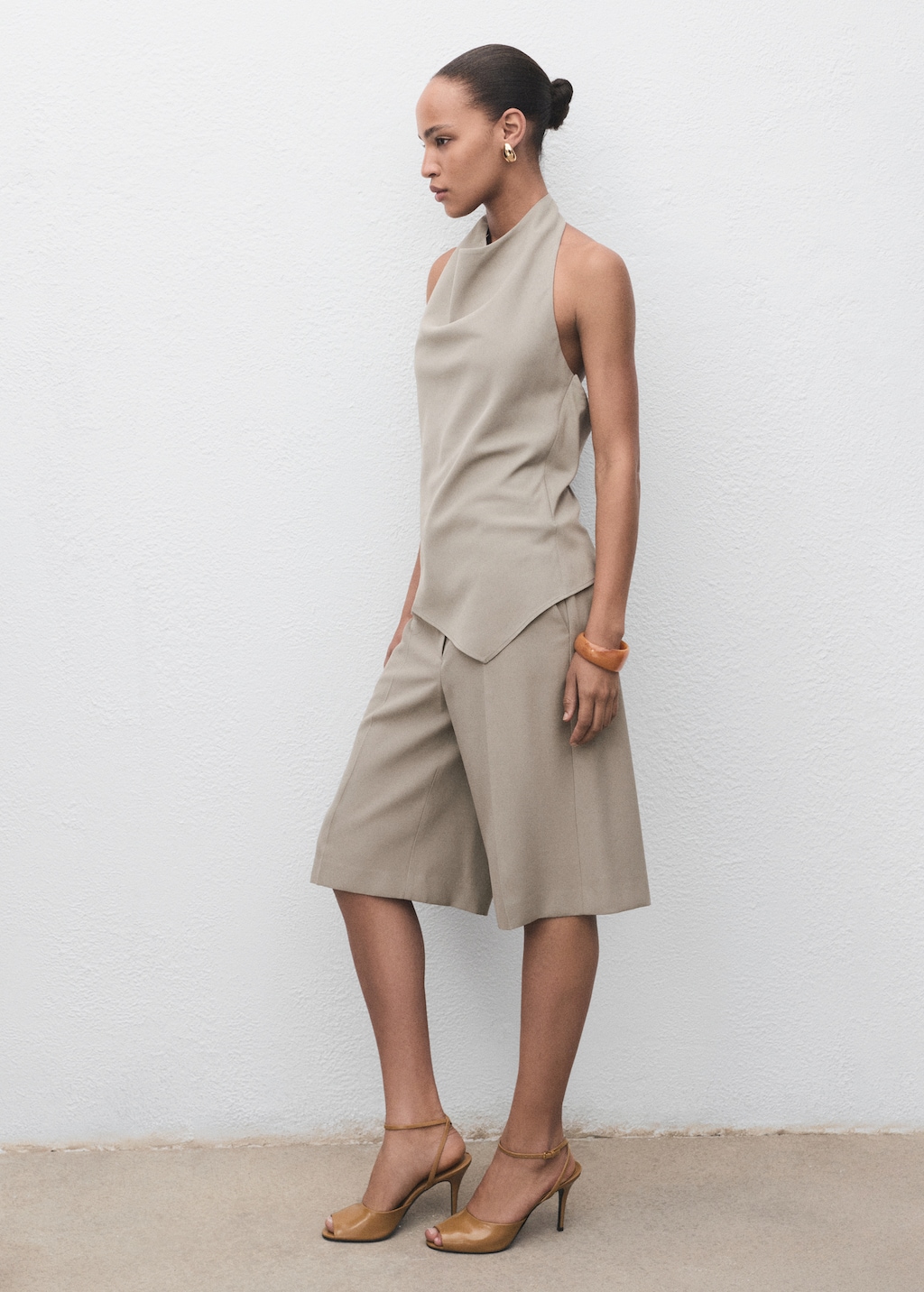 Asymmetrical open-back top