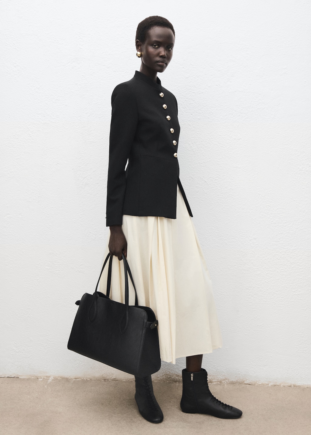 Jacket with jewel-button strip collar