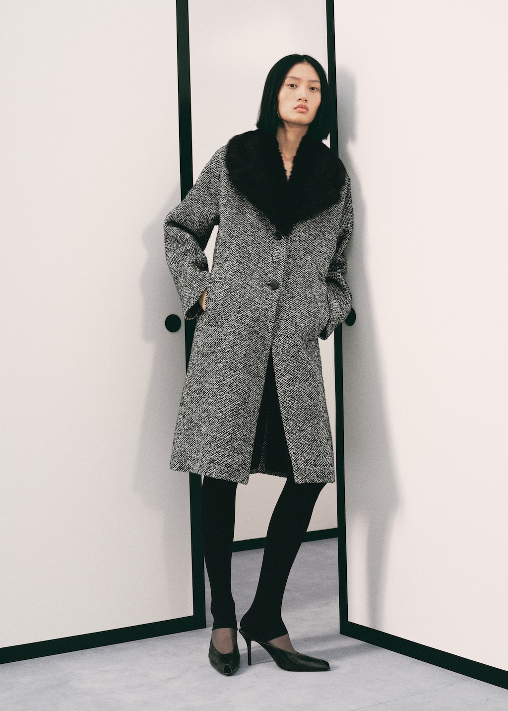 Mottled coat with fur collar