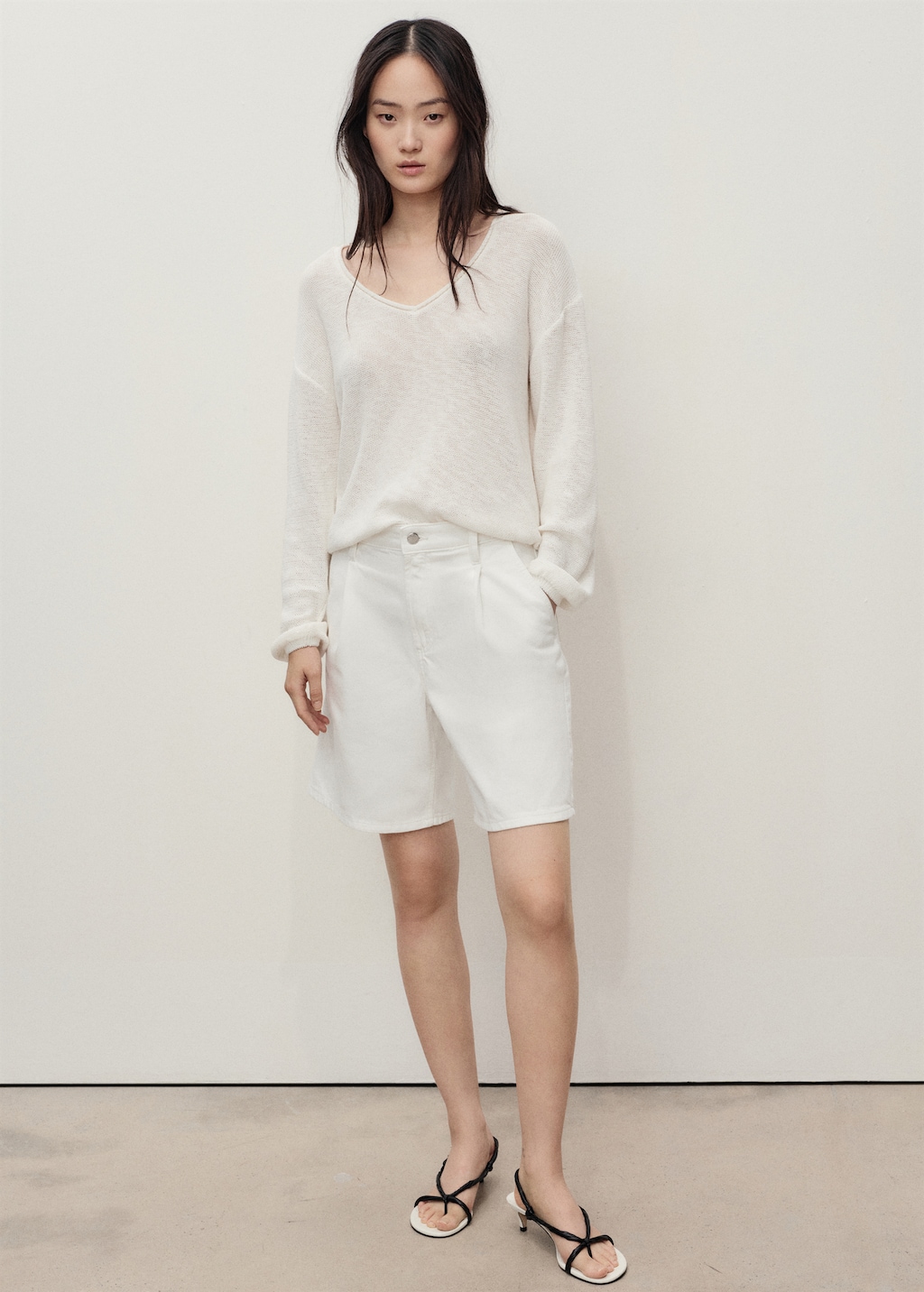 Mid-rise denim bermuda shorts with pleats