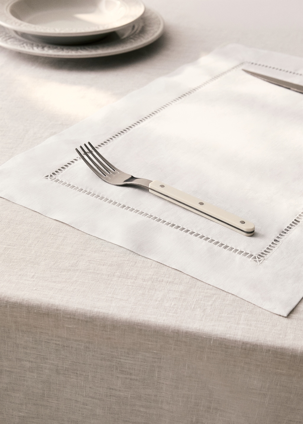 Embroidered hemstitched linen placemat