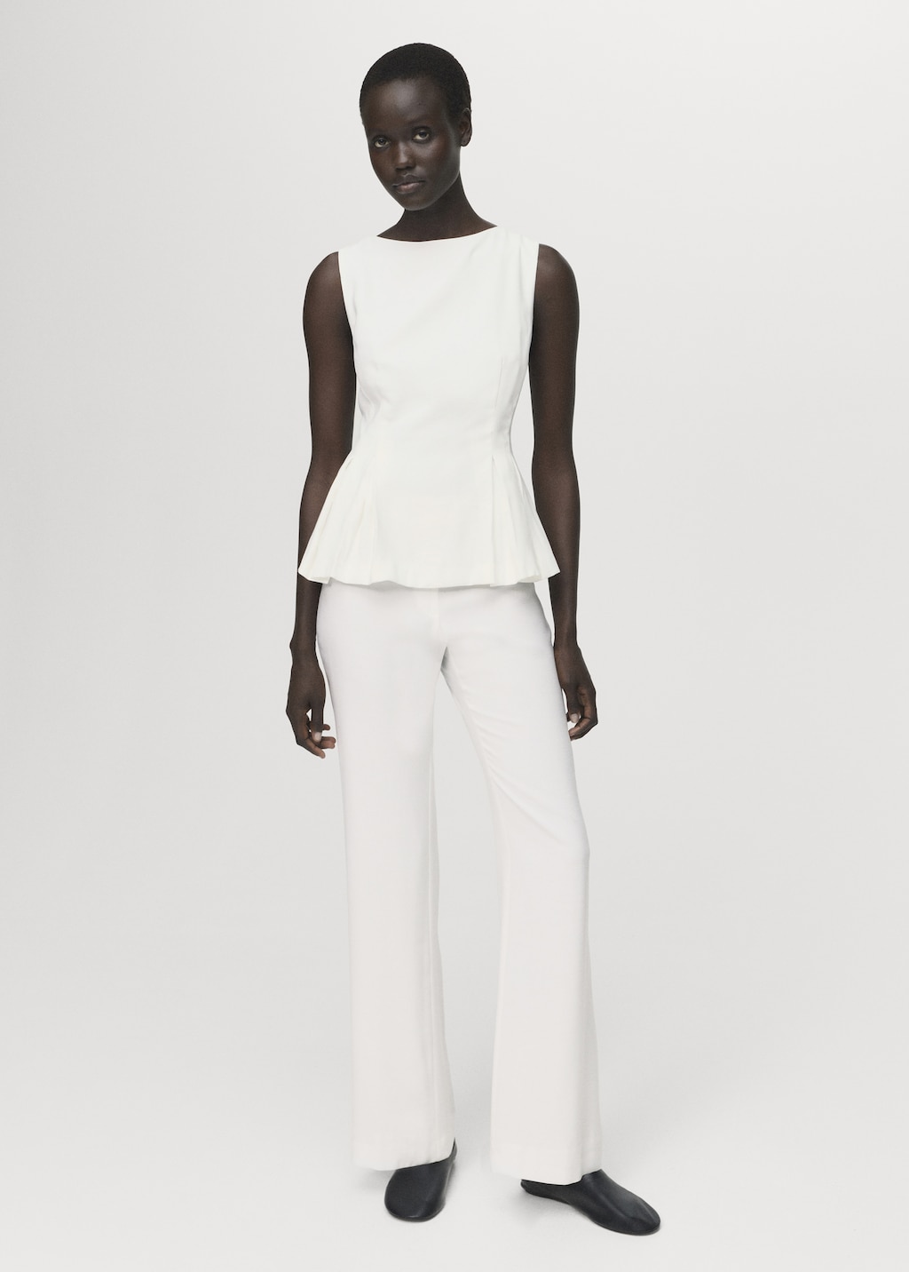 Peplum top with pleat detail