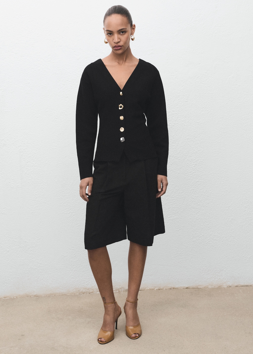 Knitted jacket with jewel buttons