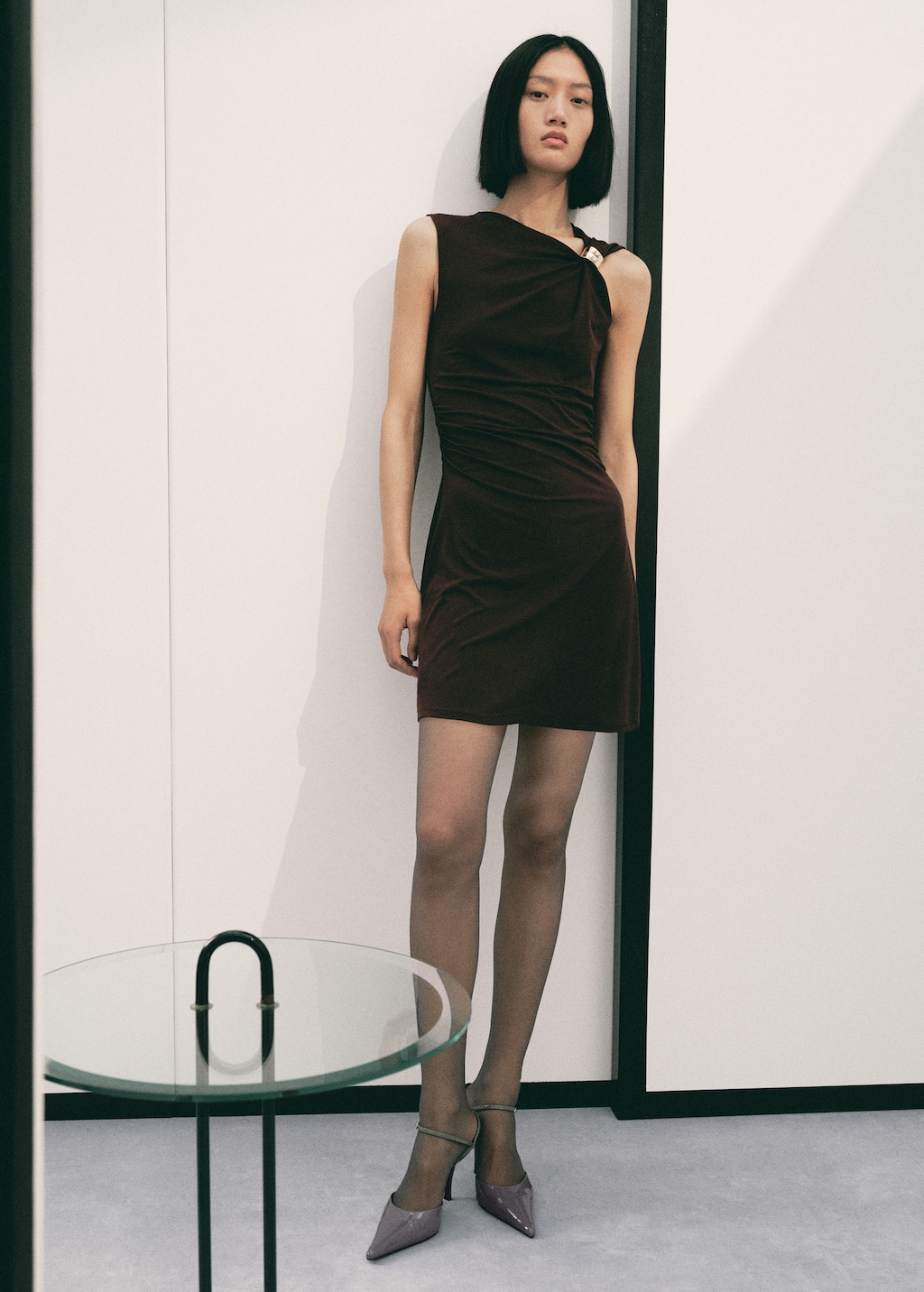 Dress with asymmetrical neck and metallic detail