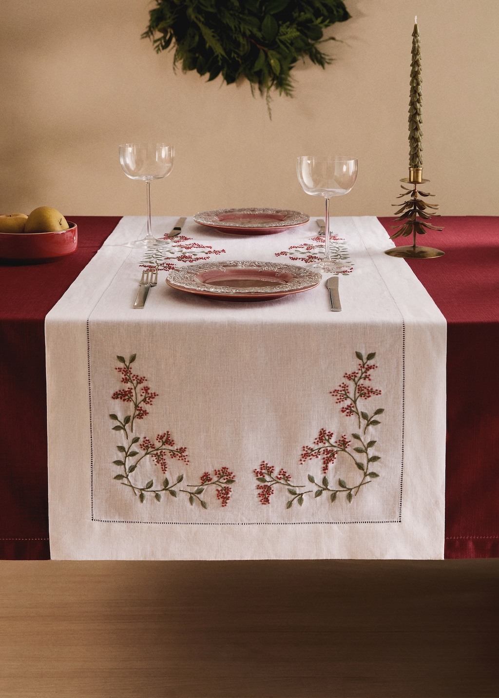 Linen table runner with embroidered floral Christmas designs