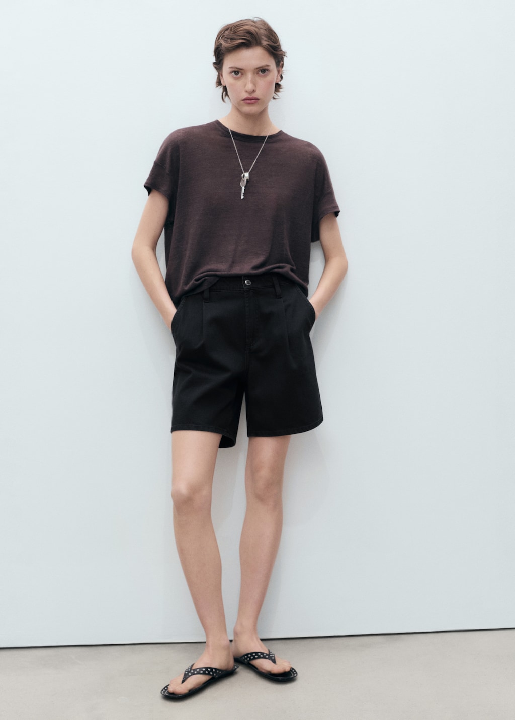 Mid-rise denim bermuda shorts with pleats