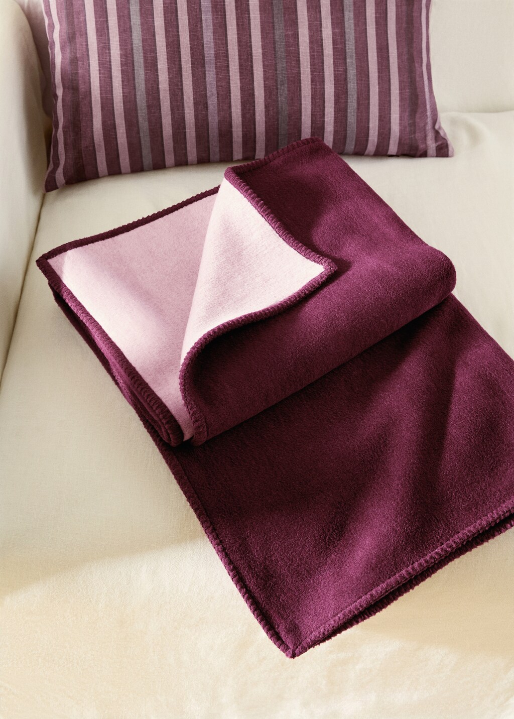 Soft fleece blanket with saddle-stitch detail