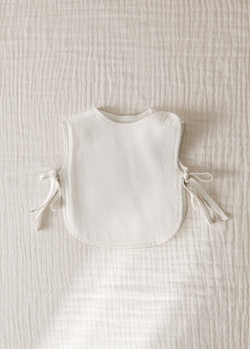 Cotton bib with decorative trim