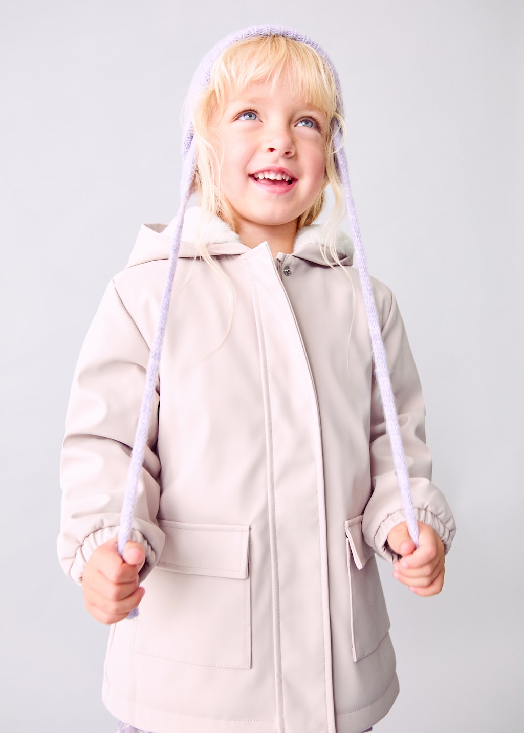 Rubberized coat with fur-effect lining