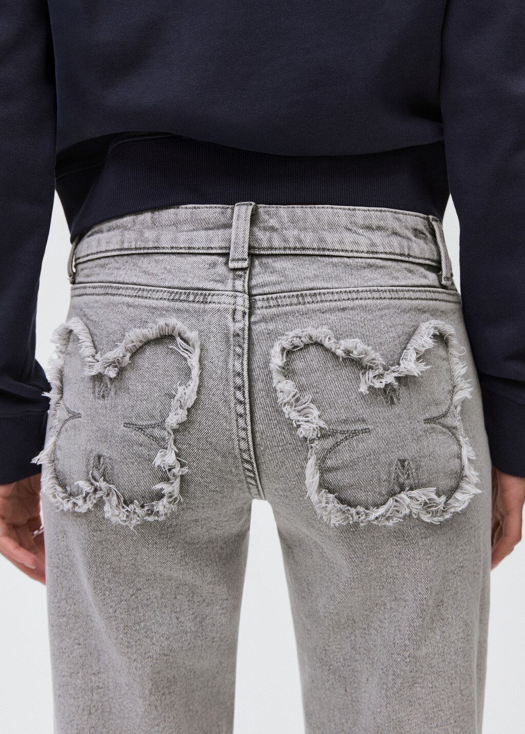 Straight jeans with embroidered butterflies