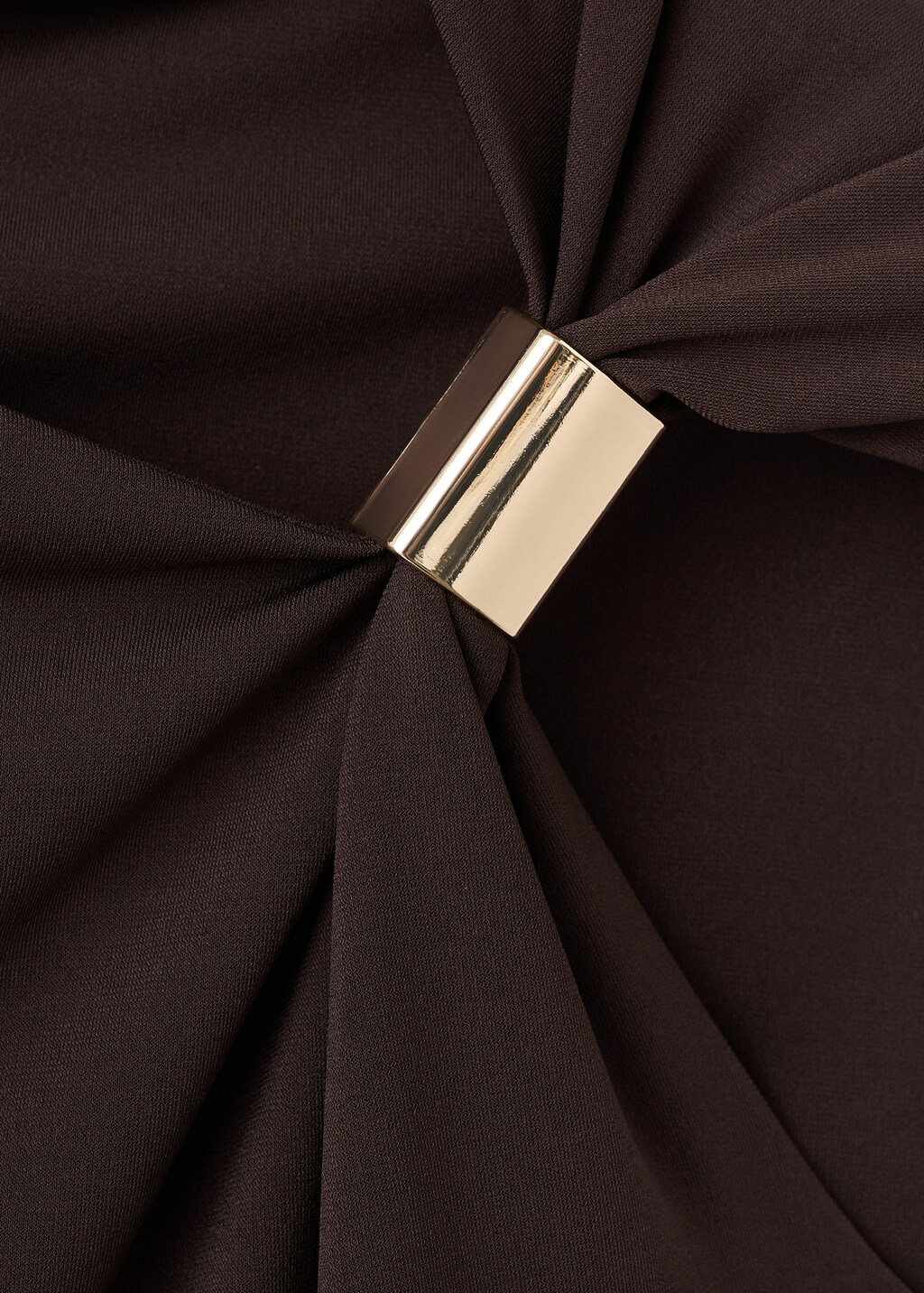 Top with asymmetrical neckline and metallic detail