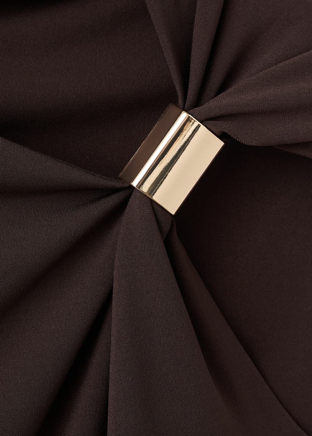 Top with asymmetrical neckline and metallic detail