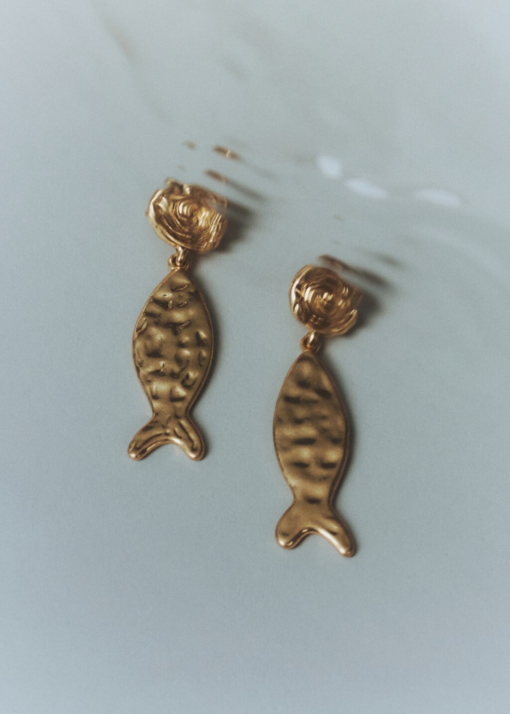 Textured fish earrings