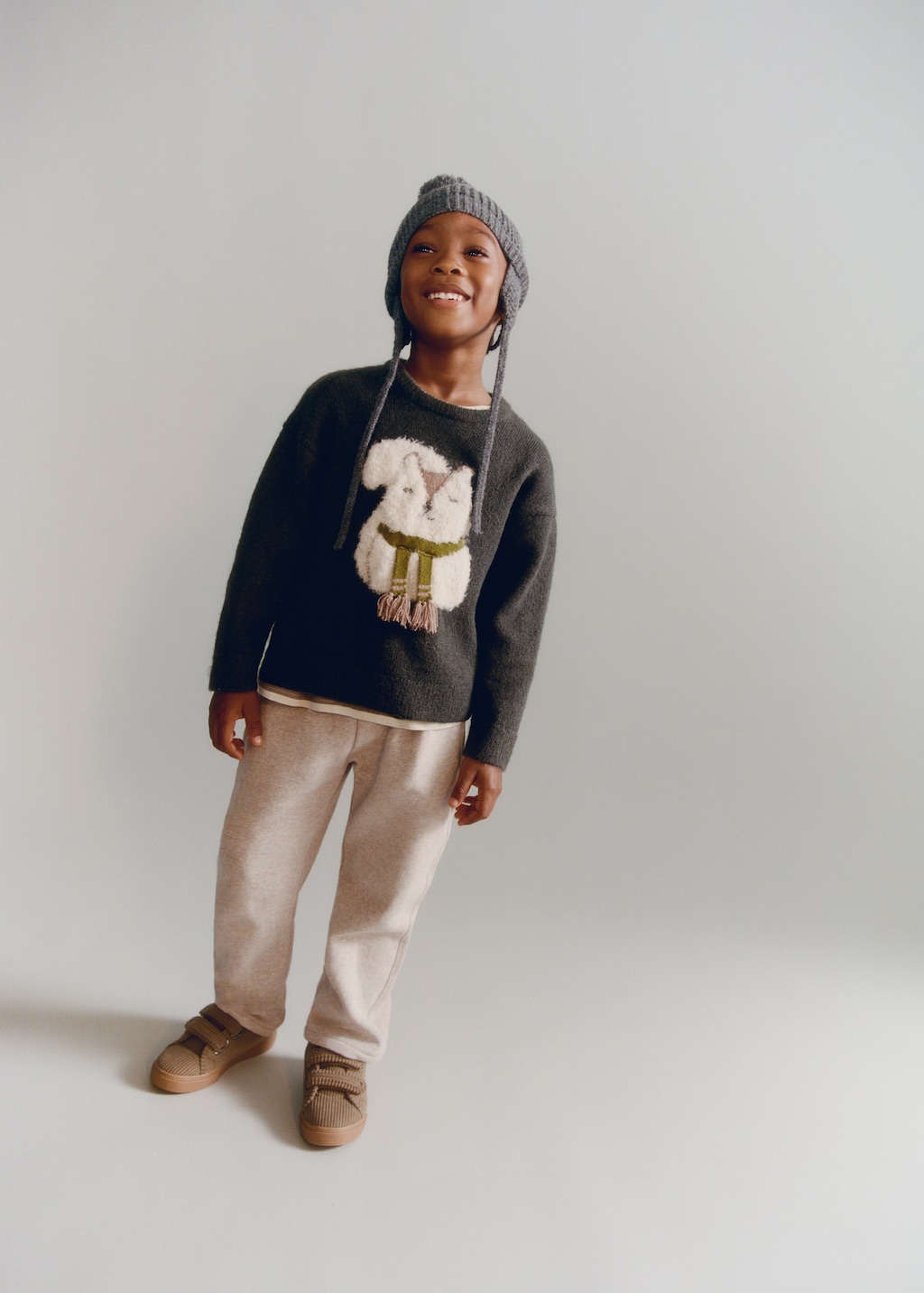 Sweater with embroidered animal