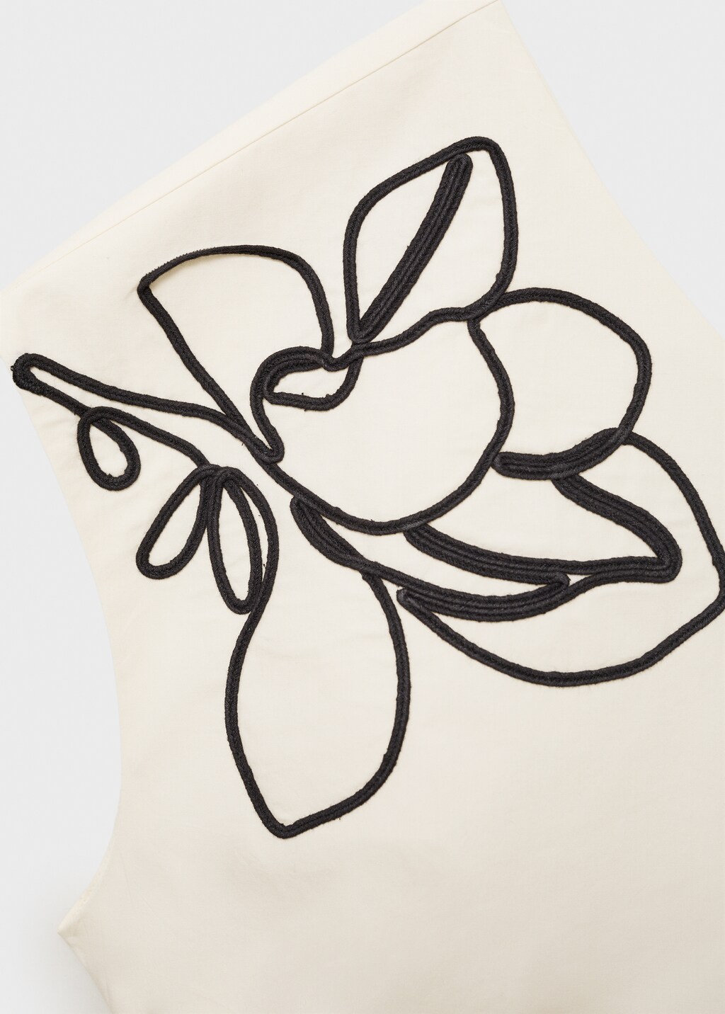 Asymmetrical flower-embroidered top