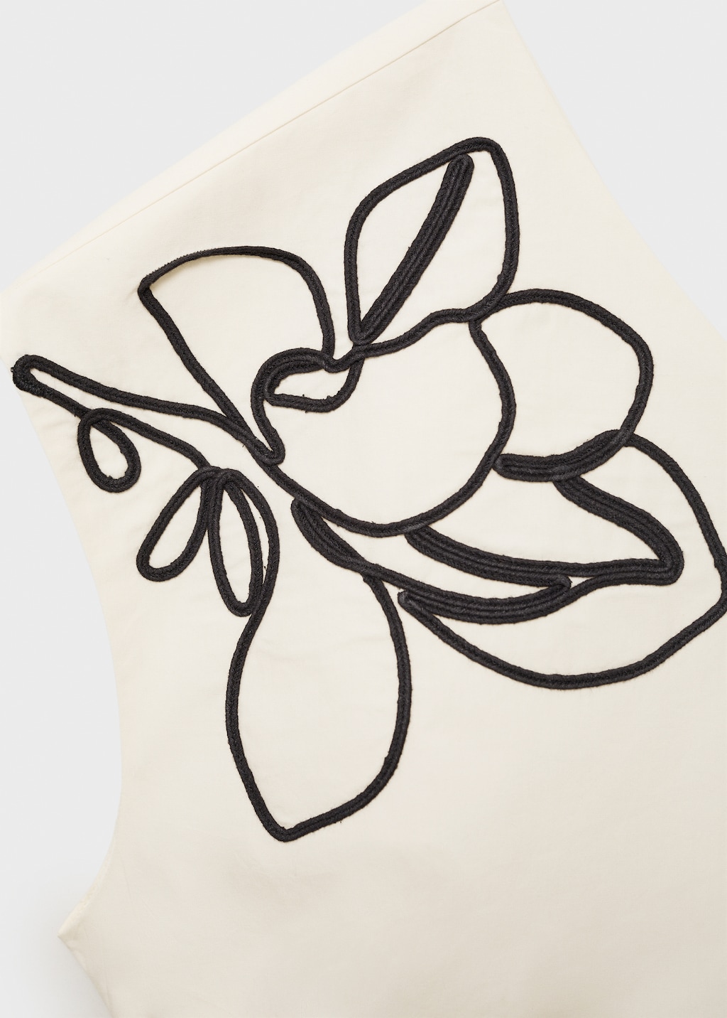Asymmetrical flower-embroidered top