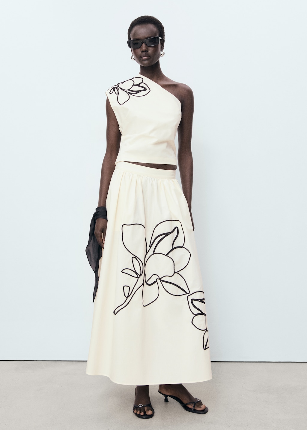 Asymmetrical flower-embroidered top