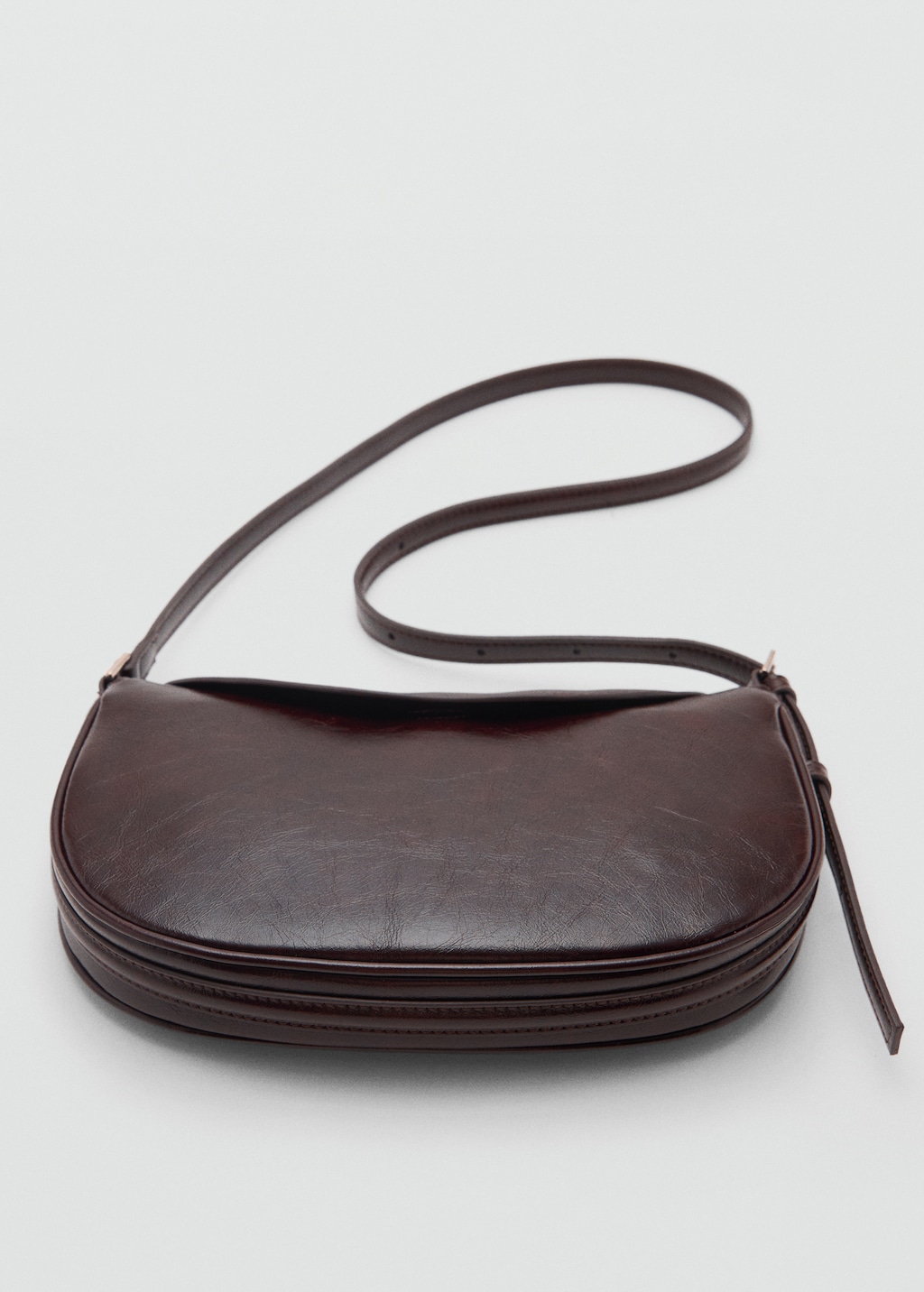 Oval shoulder bag with flap