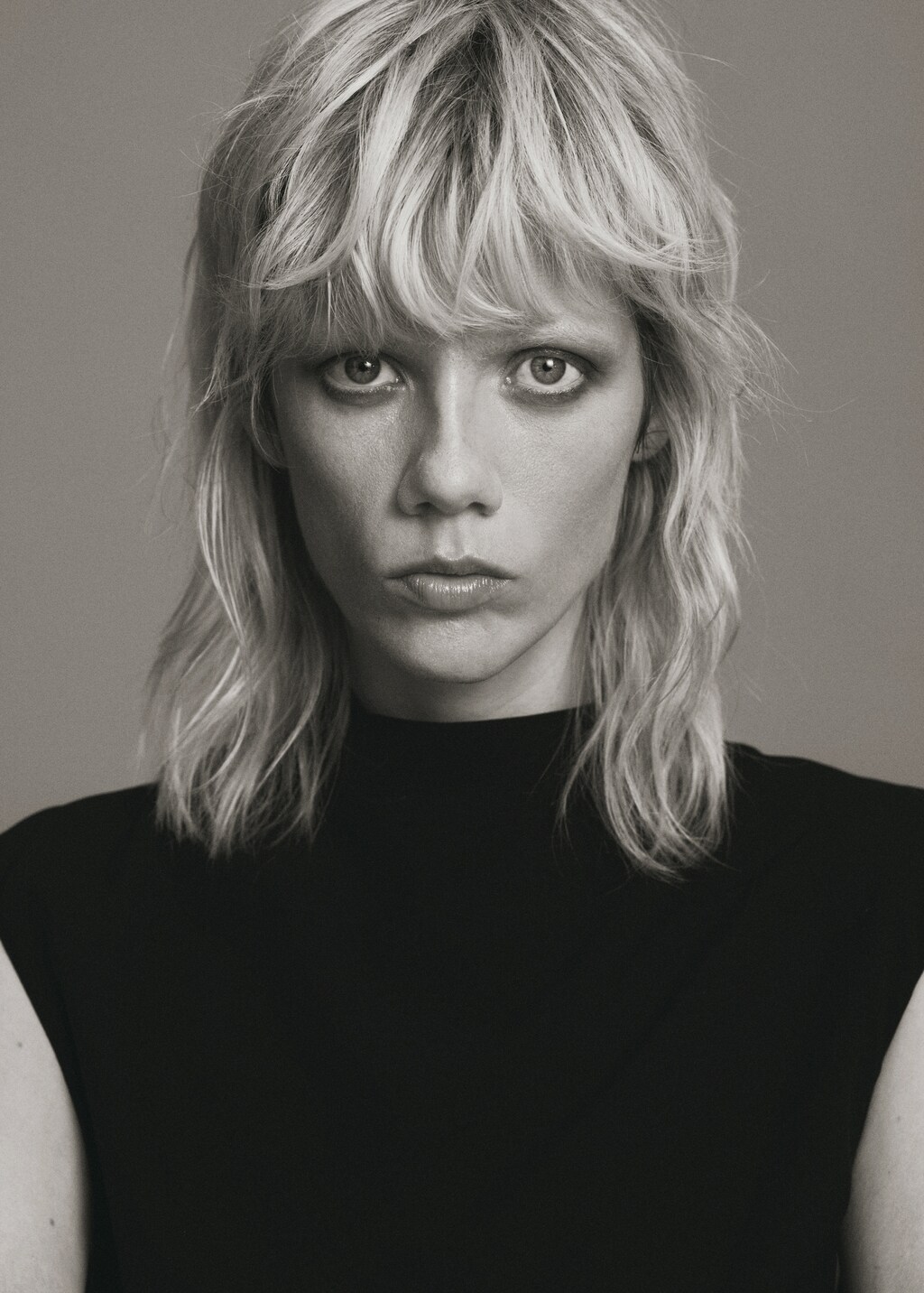 Jumpsuit with draped neck and belt