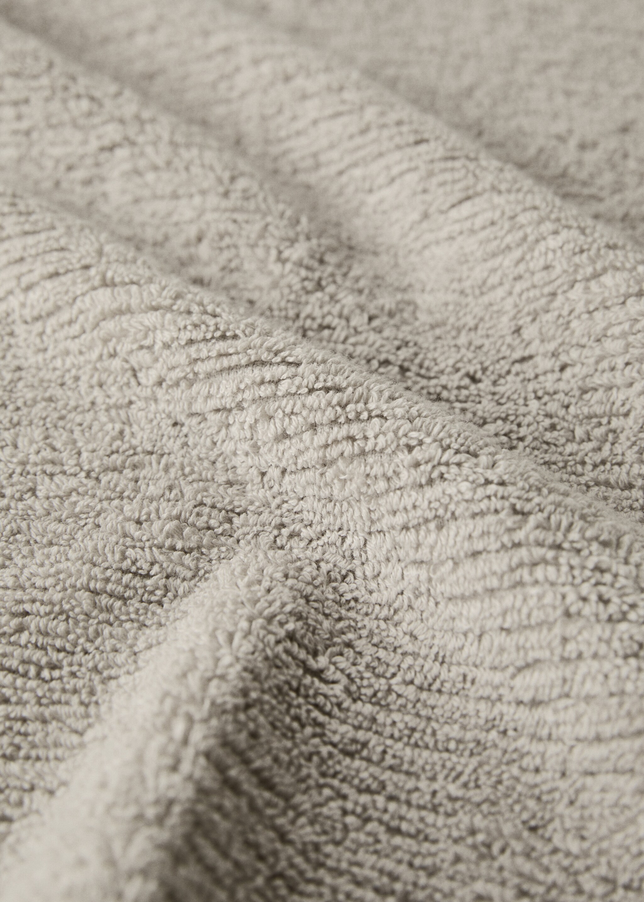 Textured hand towel with fringes - Details of the article 1, Light/Pastel Grey. Ref: 27001562-00.