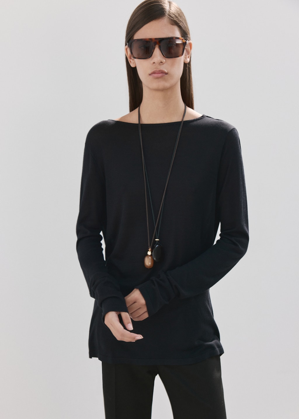 Knit sweater with draped back