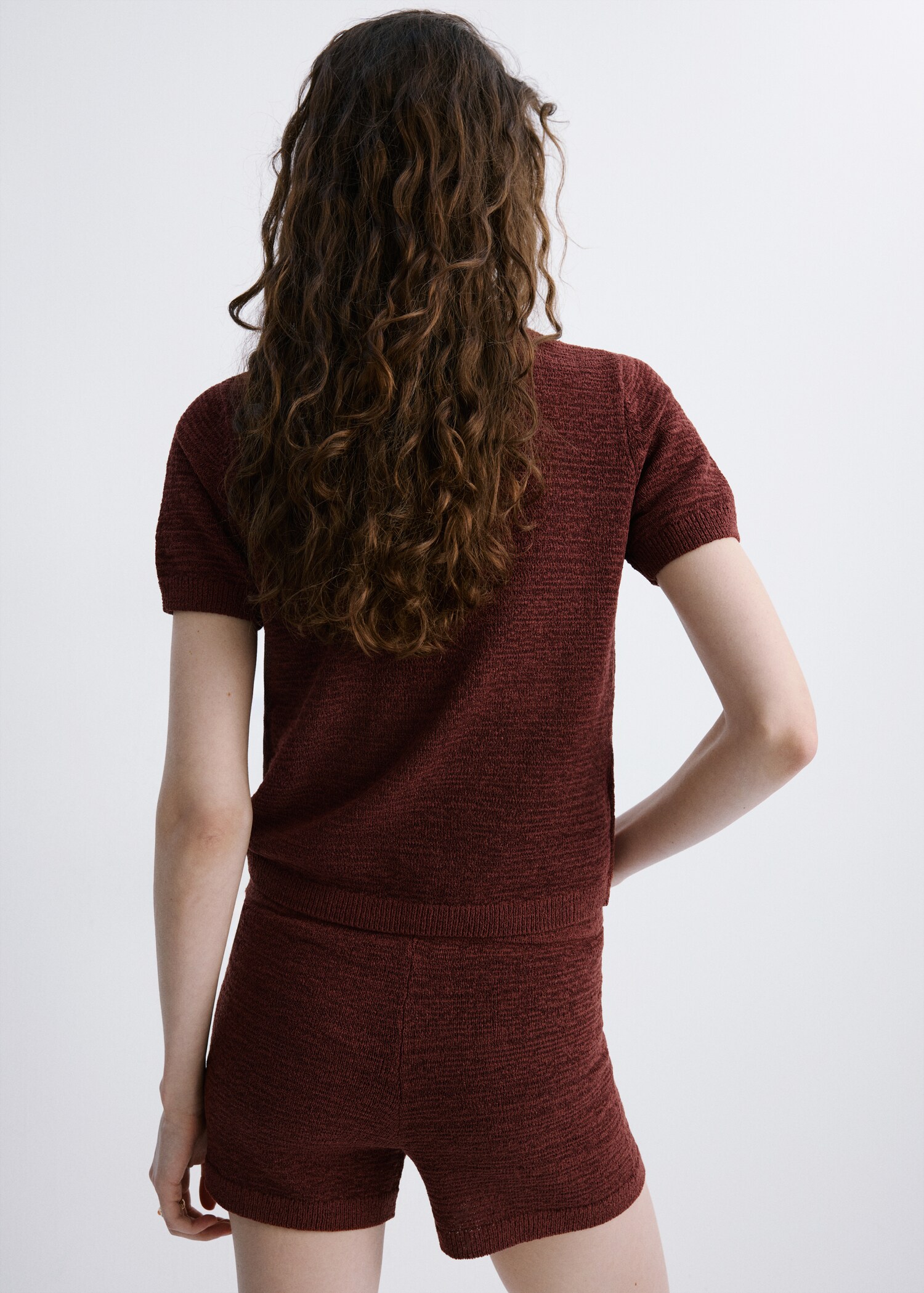 Short-sleeved knitted sweater - Reverse of the article