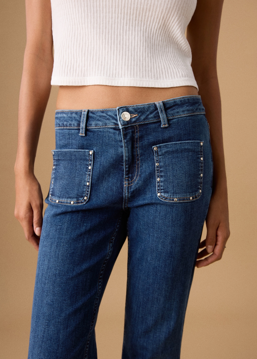 Flared jeans with studs