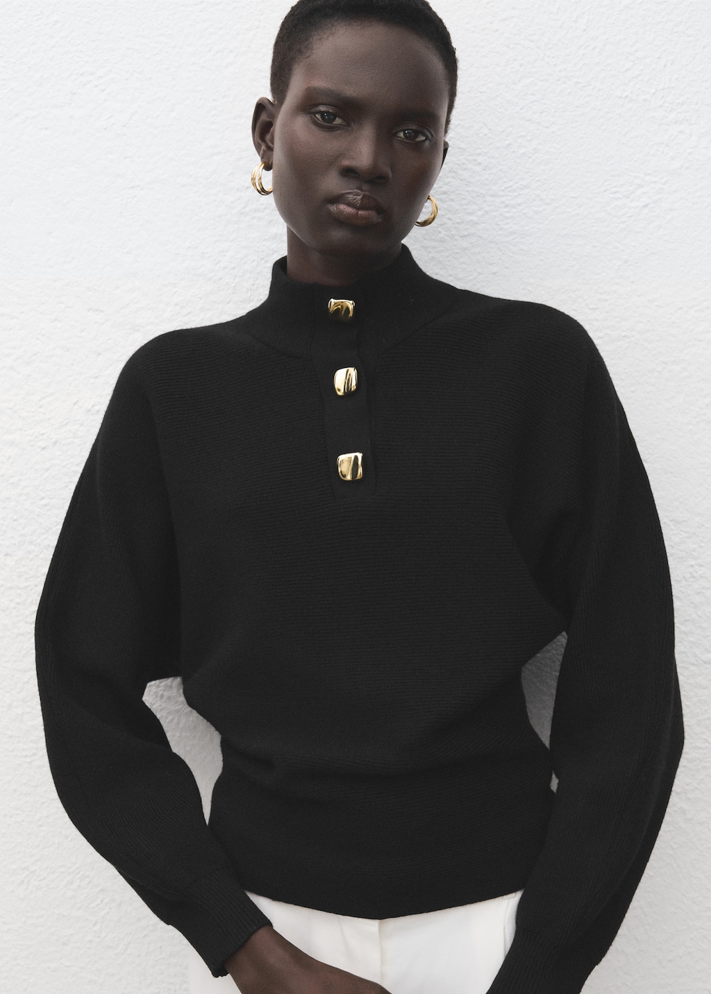 Turtleneck sweater with jewel buttons