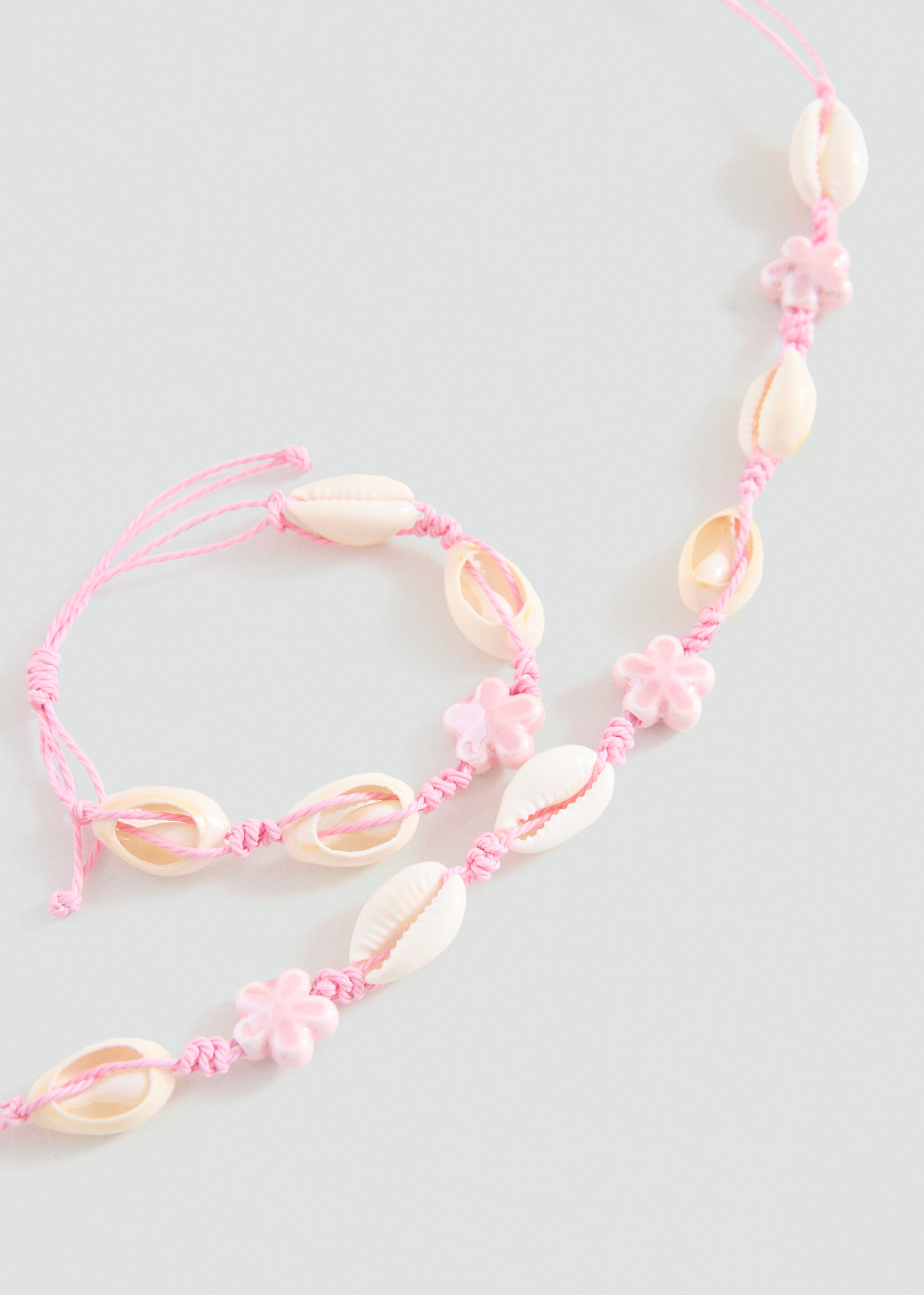 Lot collier et bracelet - Plan moyen, Rose pâle. Ref: 27014784-00.