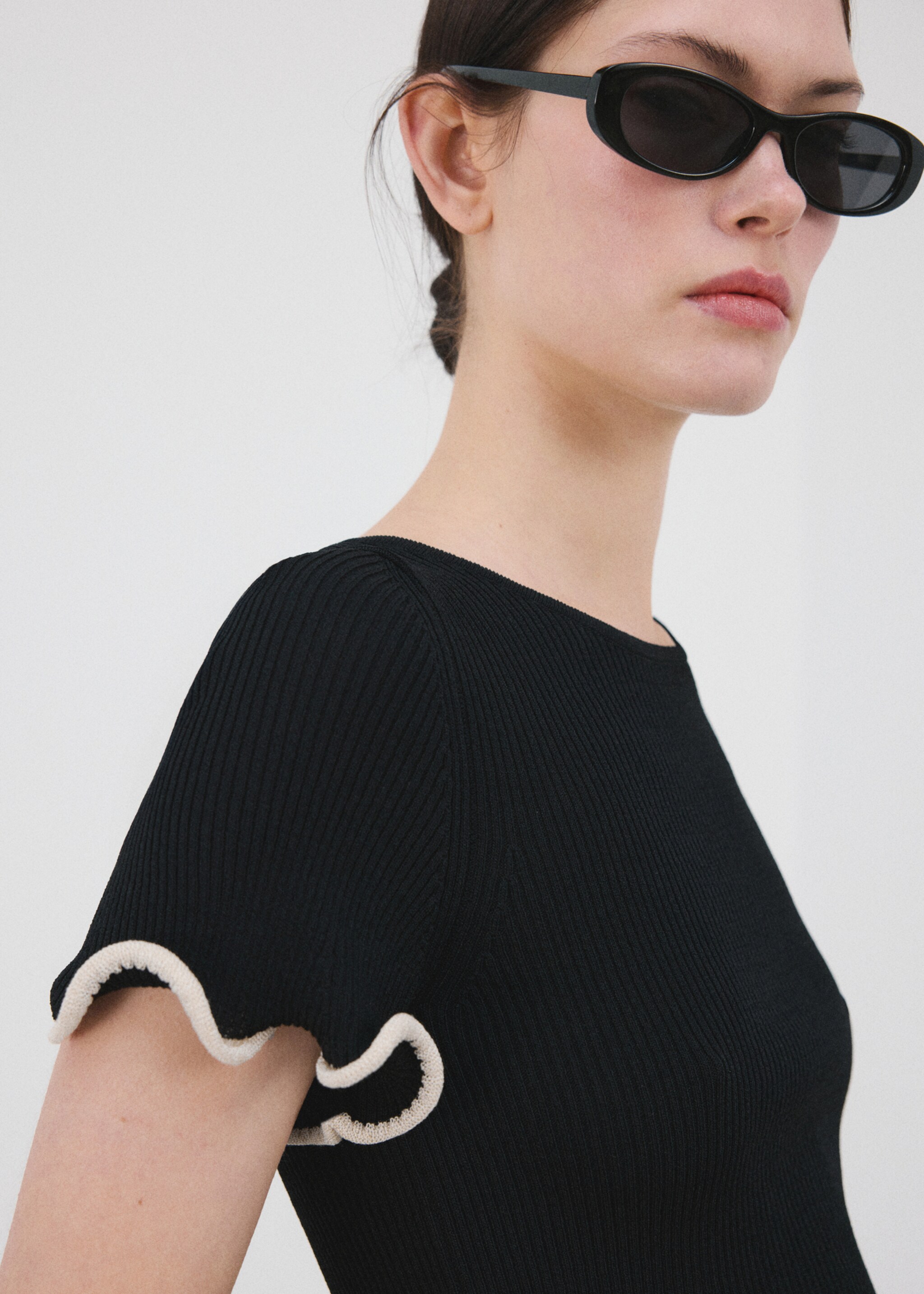 Peplum jumper with contrasting trims - Details of the article 1, Black. Ref: 27015846-00.