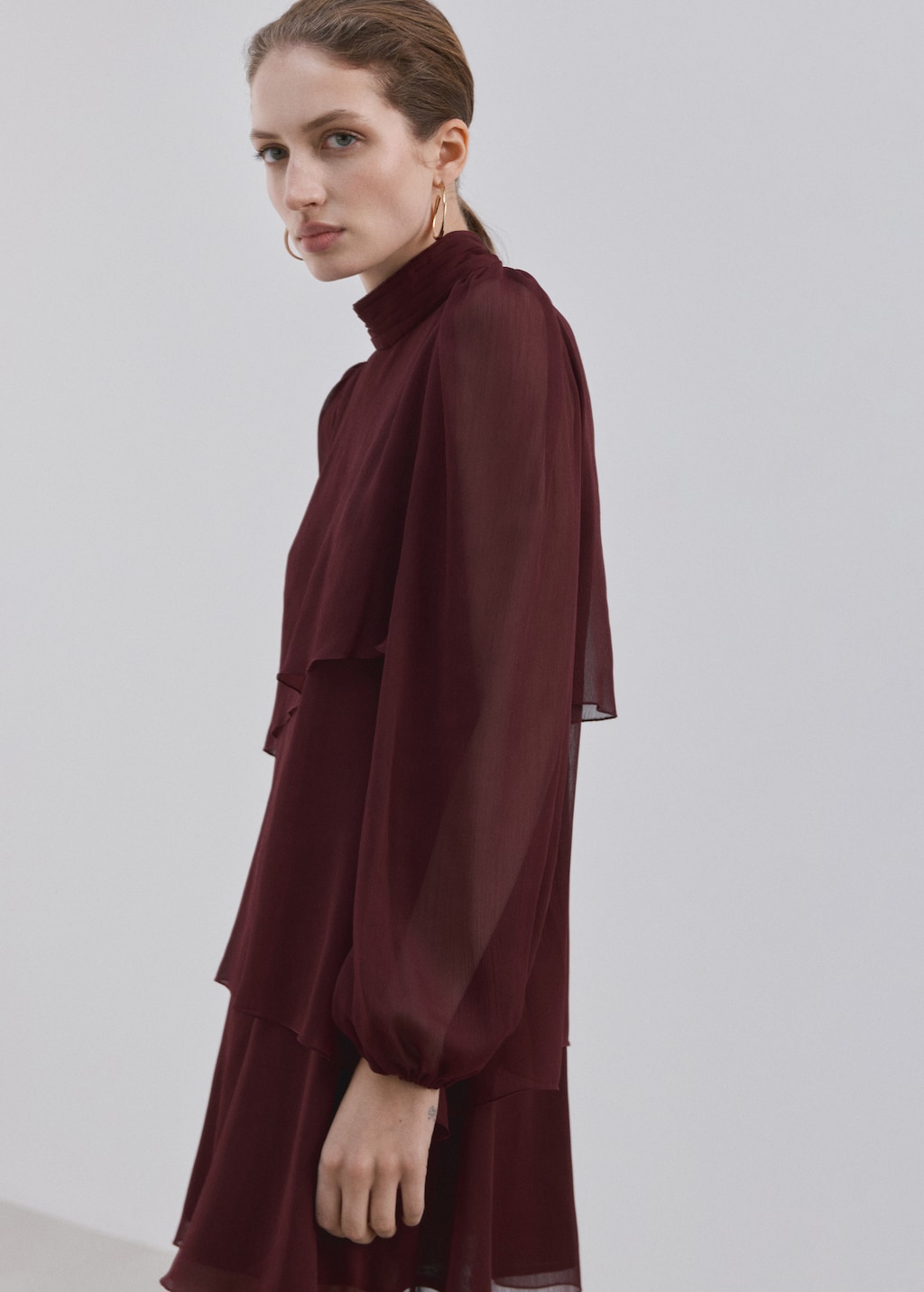 Ruffled dress with draped collar