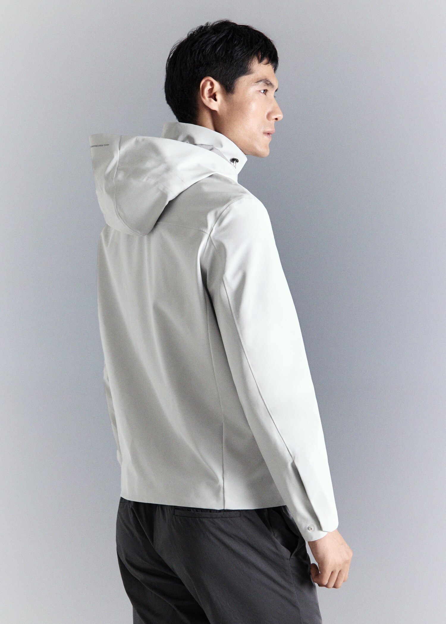 Water-repellent bomber jacket with detachable hood - Reverse of the article