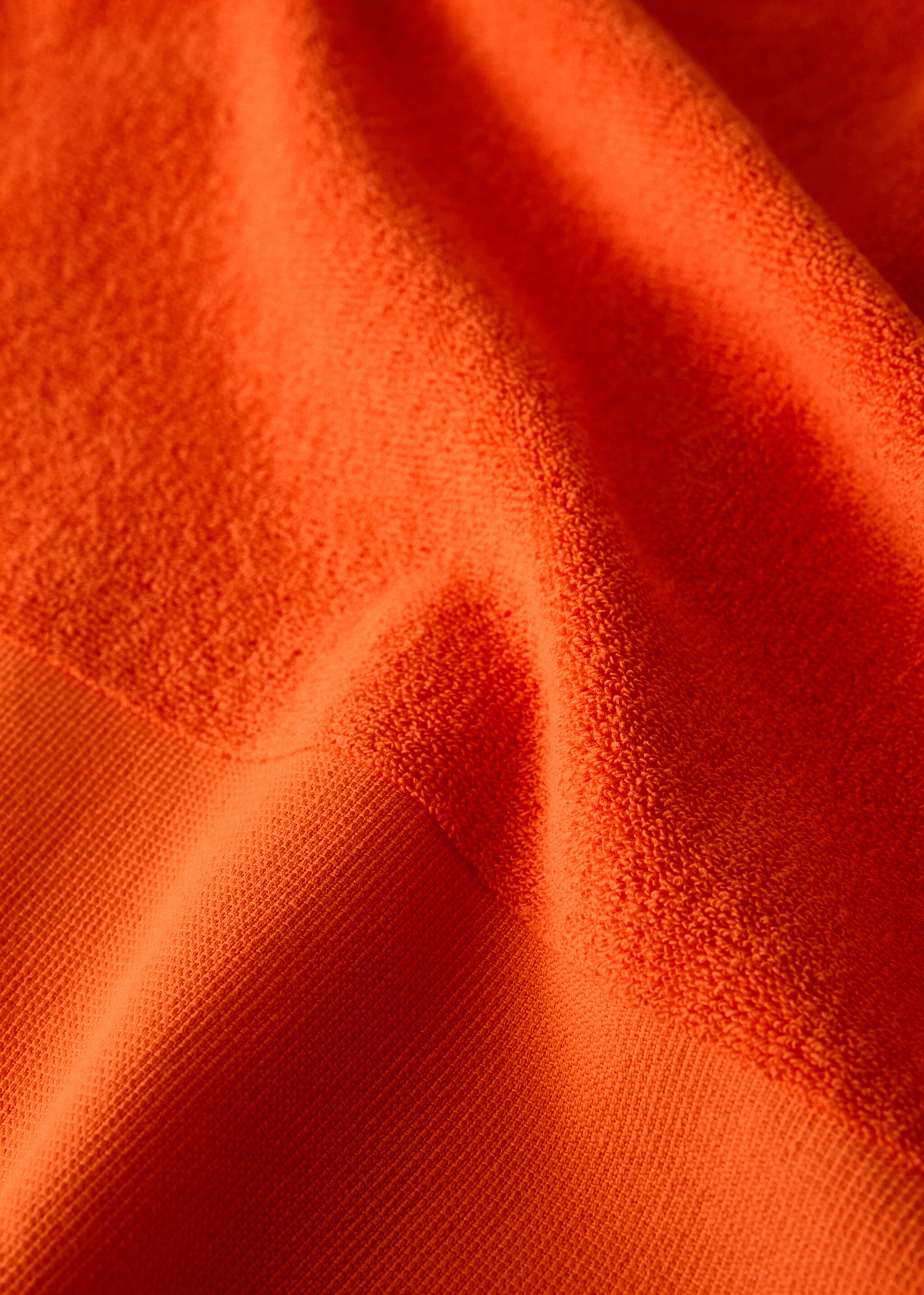 Plain overdyed beach towel with tassels - Details of the article 2, Orange. Ref: 27026353-00.